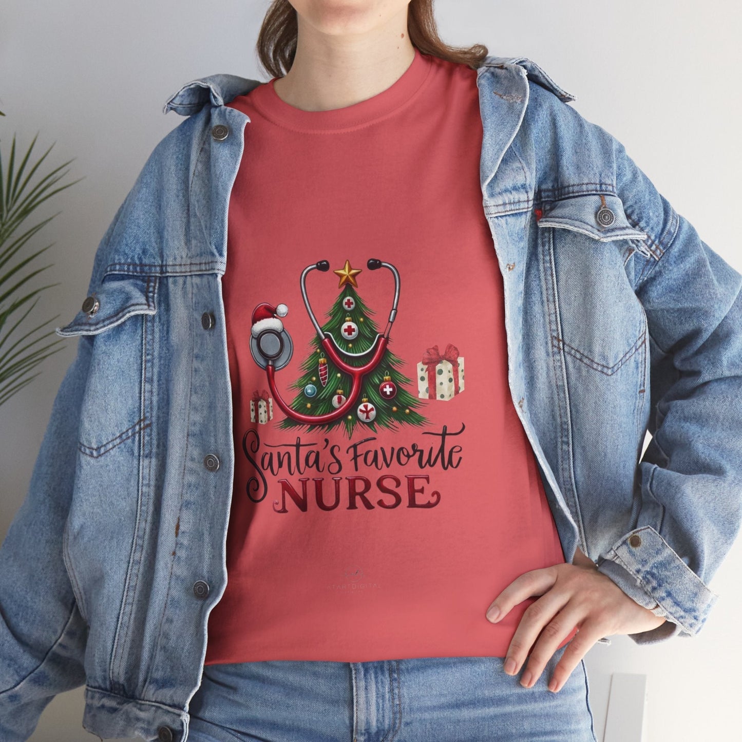 Santas Favorite Nurse Shirt with holiday-themed design, worn by a person in a denim jacket, perfect Christmas gift for nurses.