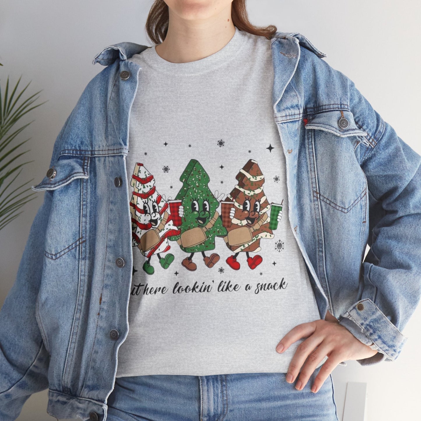 Festive "Out Here Looking Like a Snack" Christmas shirt with whimsical holiday characters, perfect seasonal gift.