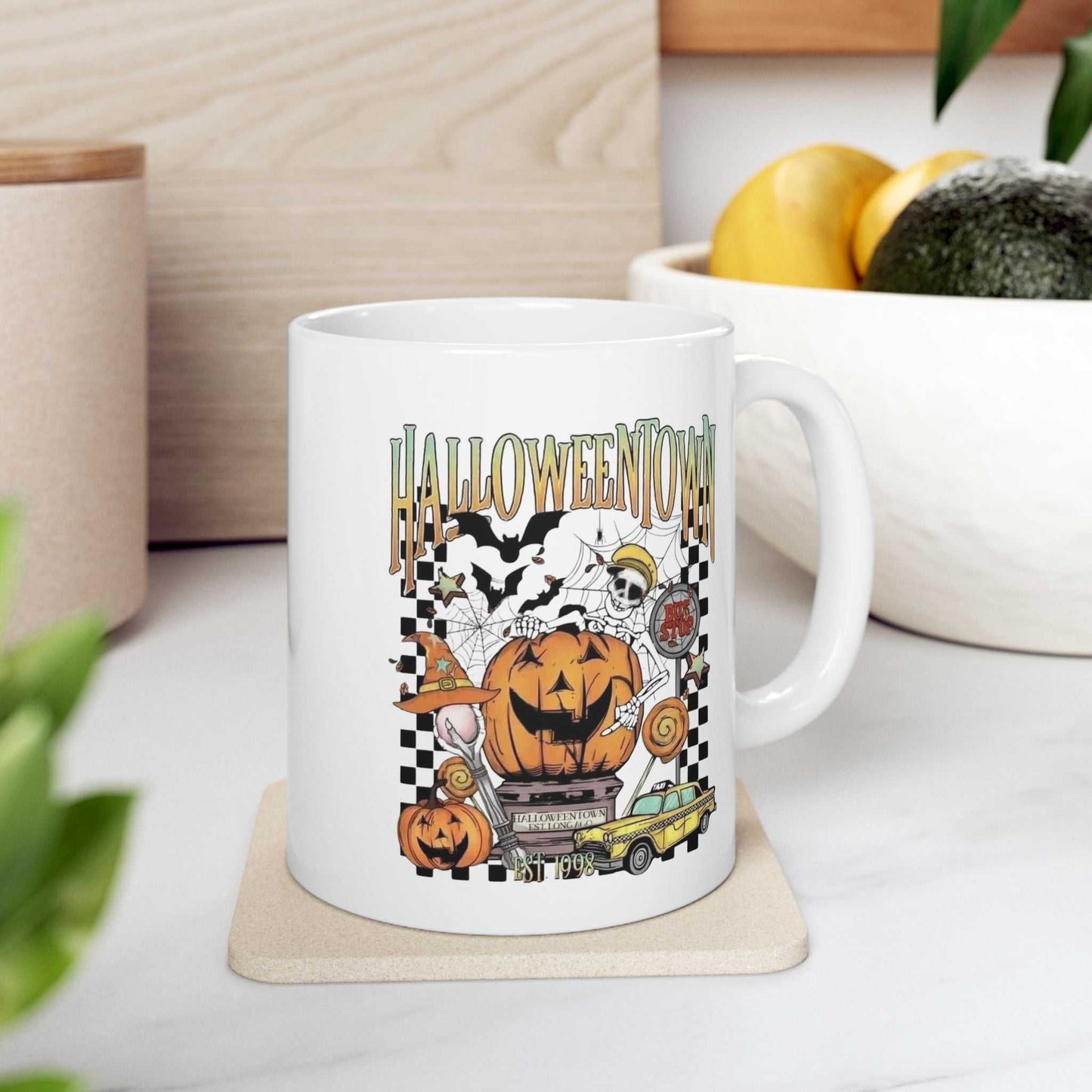 Retro Halloweentown ceramic mug with colorful vintage Halloween design, perfect for coffee lovers.