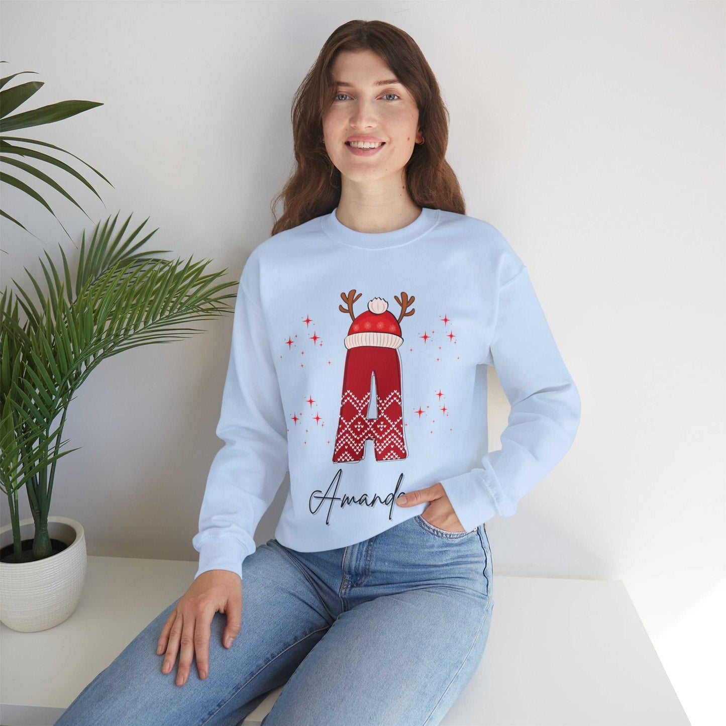 Family Christmas name sweatshirt with reindeer design and "Amanda" personalization.