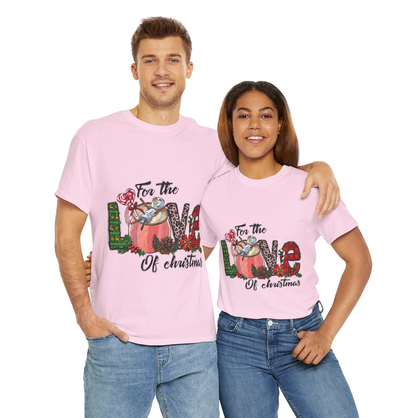 Christmas couple wearing 'For The Love Of Christmas' shirts, pink festive tee with love-themed design.