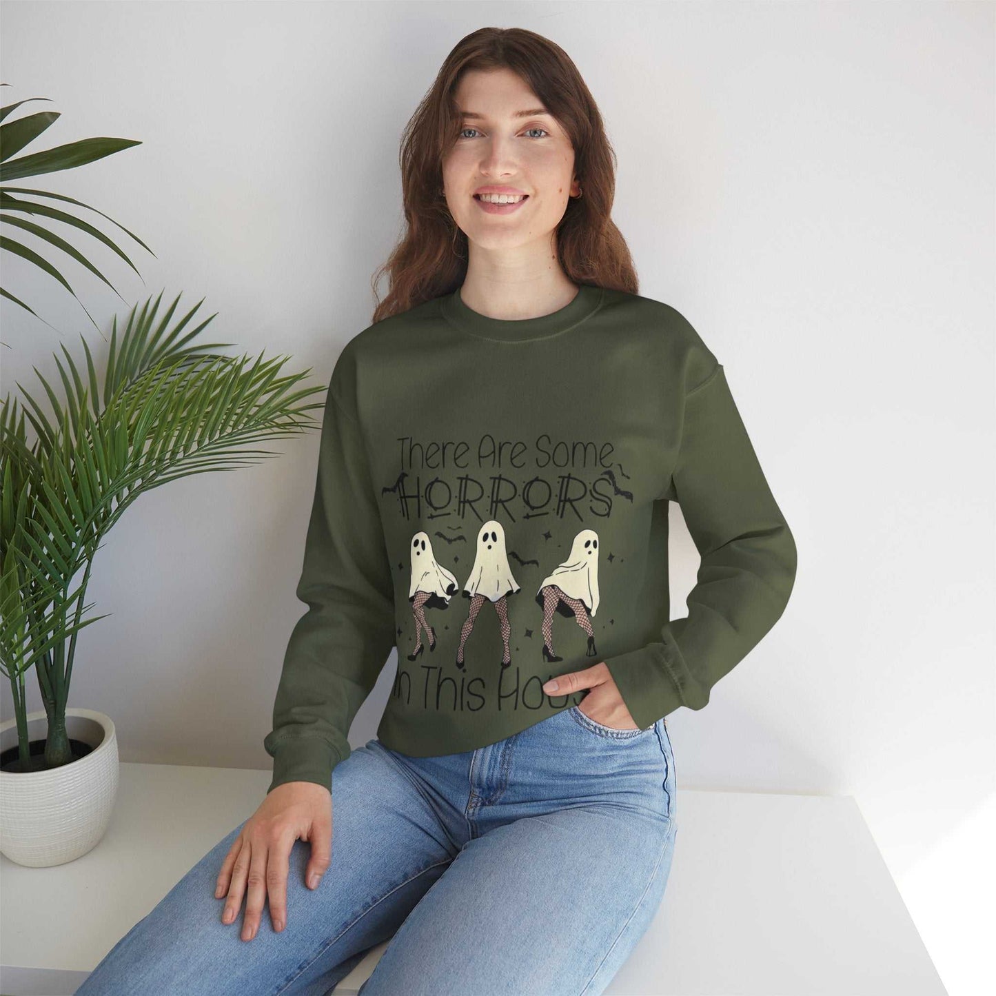 Funny Halloween sweatshirt with ghost design and "There Are Some Horrors in This House" text. Ideal for spooky season.