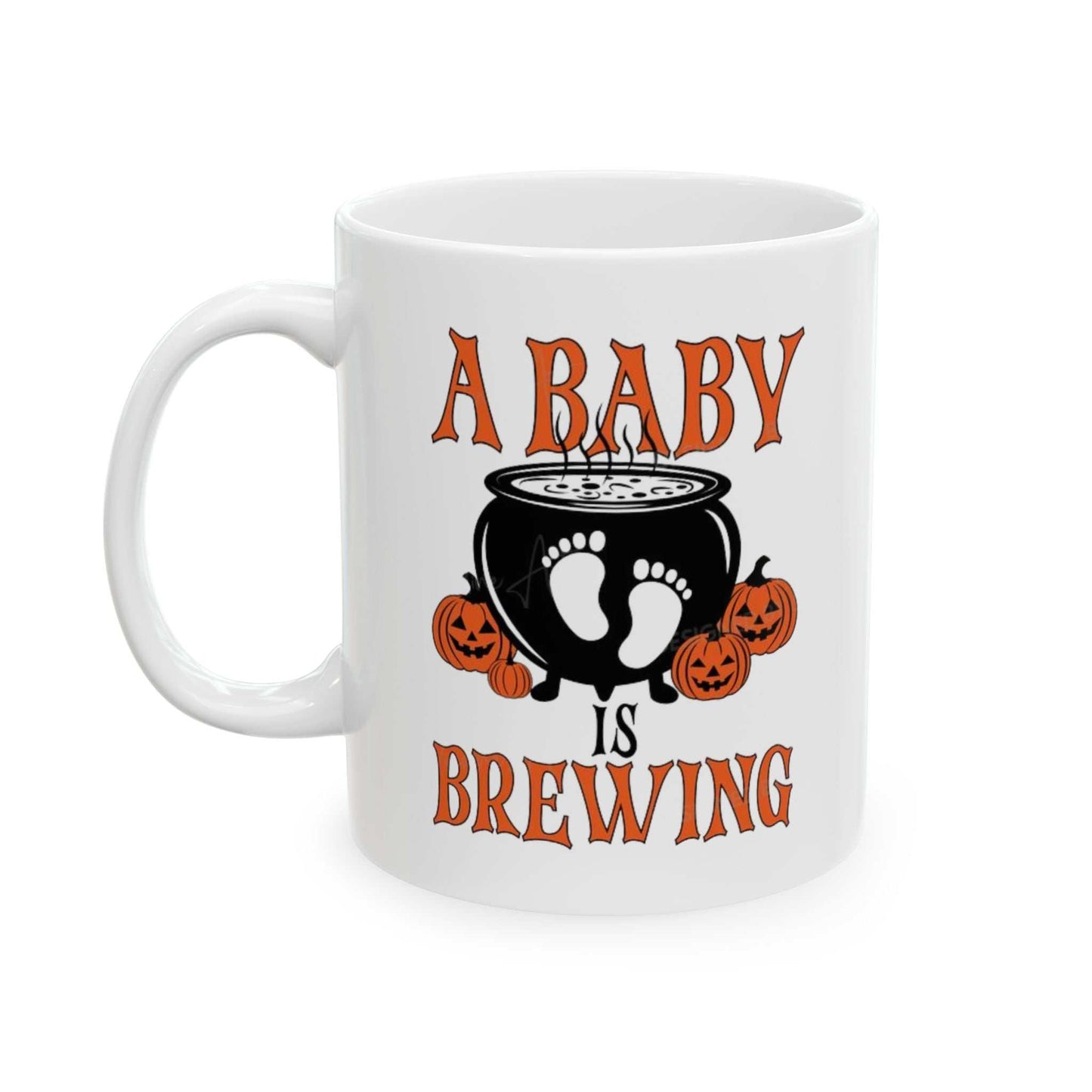 Ceramic coffee mug with "A Baby is Brewing" Halloween pregnancy announcement design, featuring a cauldron and pumpkins.