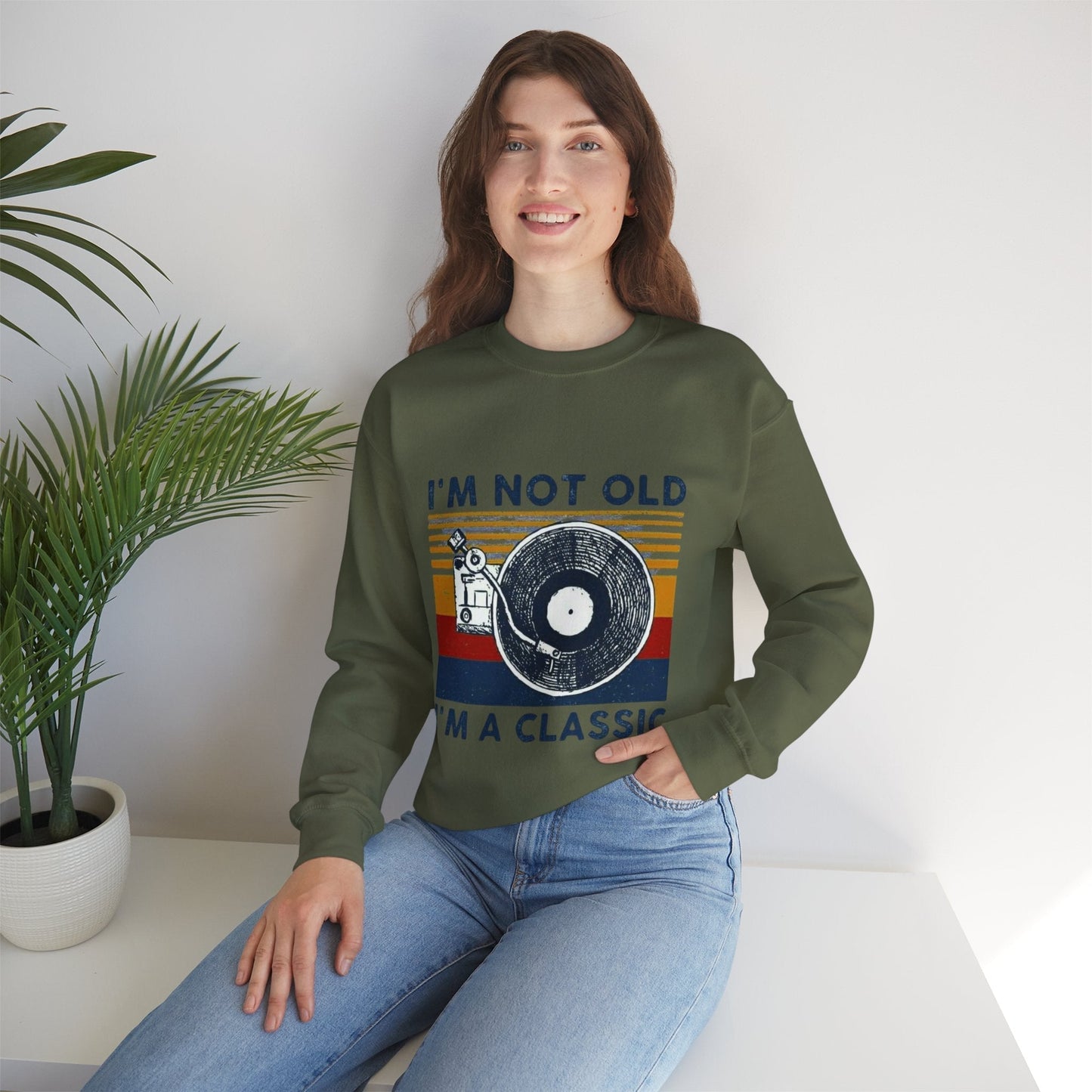 Unisex green crewneck sweatshirt with vintage 'I'm Not Old I'm a Classic' design, featuring a vinyl record graphic.