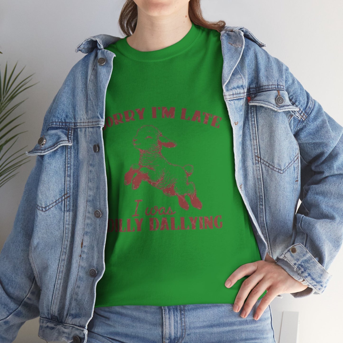 Funny Unisex Heavy Cotton Tee with "Sorry I'm Late, I Was Dilly Dallying" lamb design worn with denim jacket.