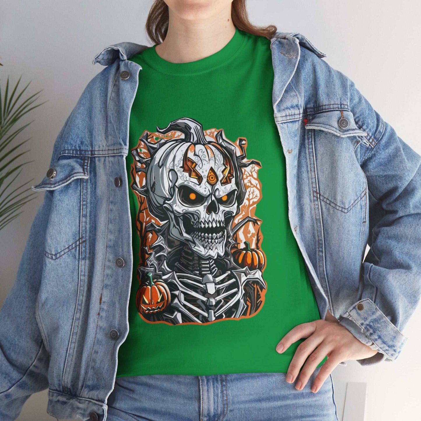 Halloween skeleton shirt with skull and pumpkins design on green t-shirt.