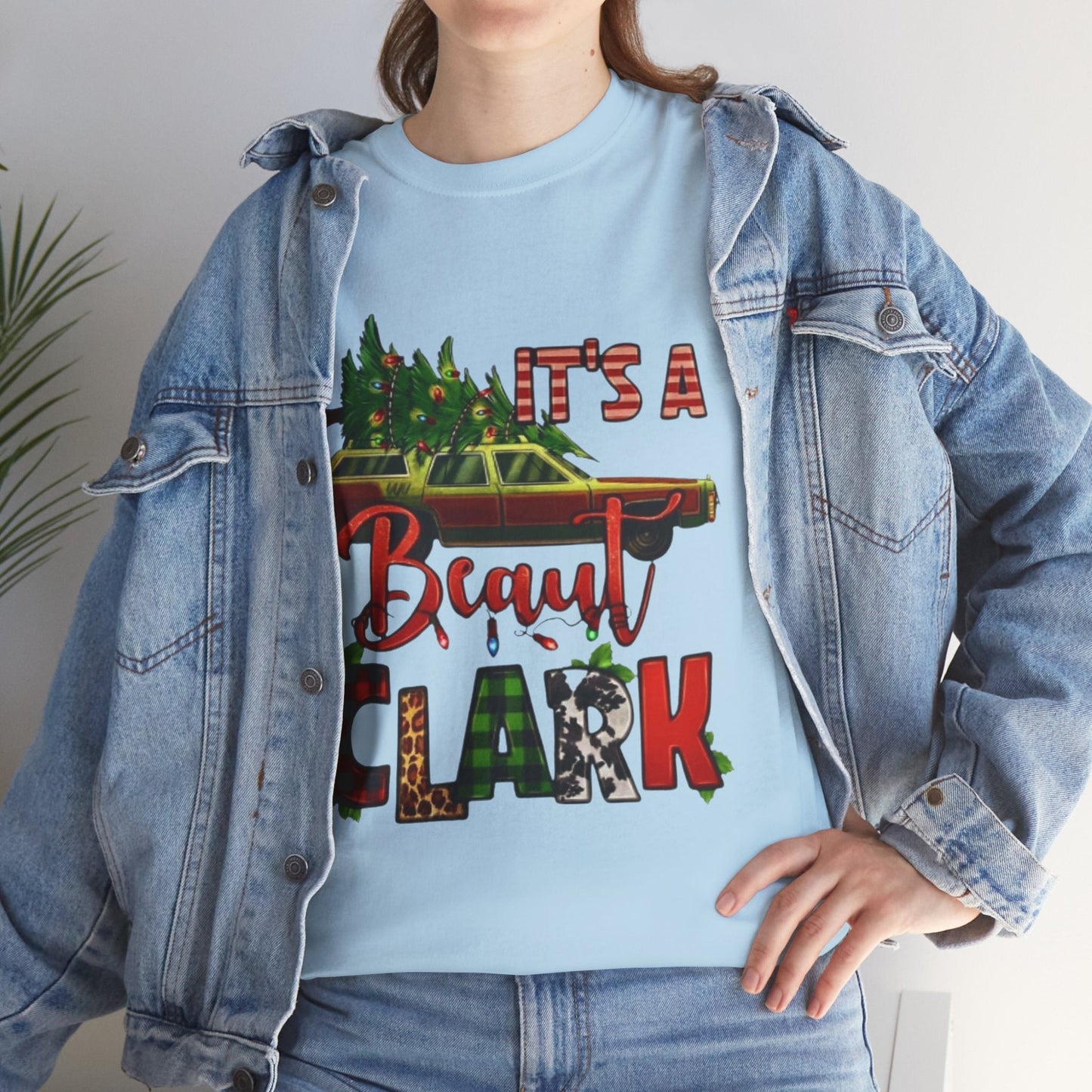 Retro "It's A Beaut Clark" Christmas shirt with vintage design and holiday theme.