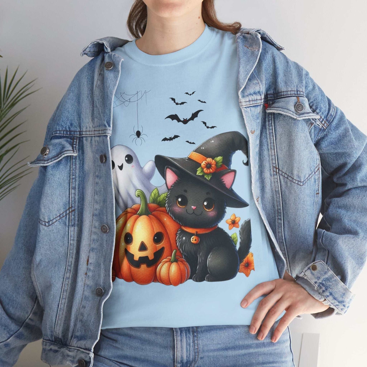 Halloween Cat Kids Shirt featuring a cute black cat with a pumpkin and ghost design, perfect for spooky season.