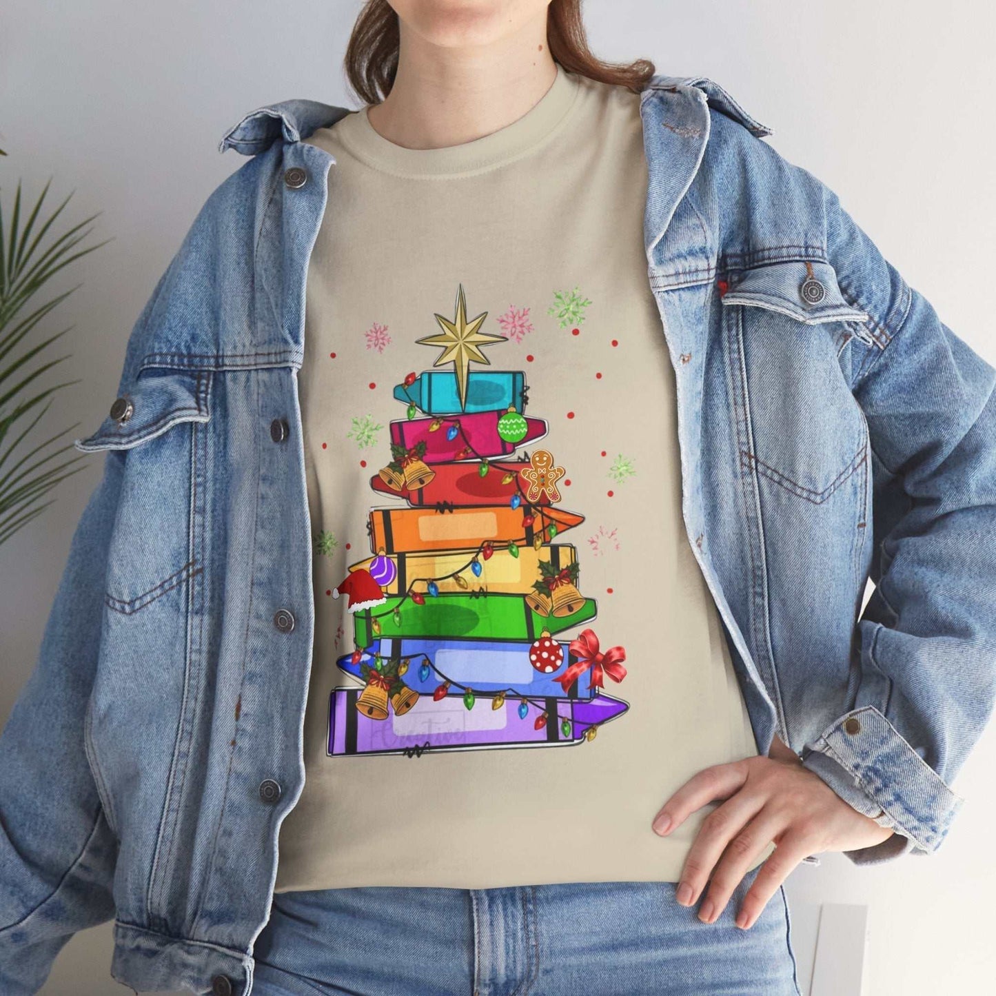 Crayons Christmas Tree T-Shirt featuring a crayon-designed tree, ideal teacher team gift.
