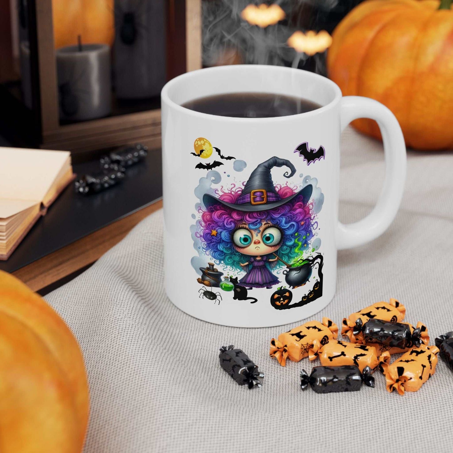 Ceramic Halloween girl ghost mug with colorful witch design, surrounded by pumpkins and Halloween treats.