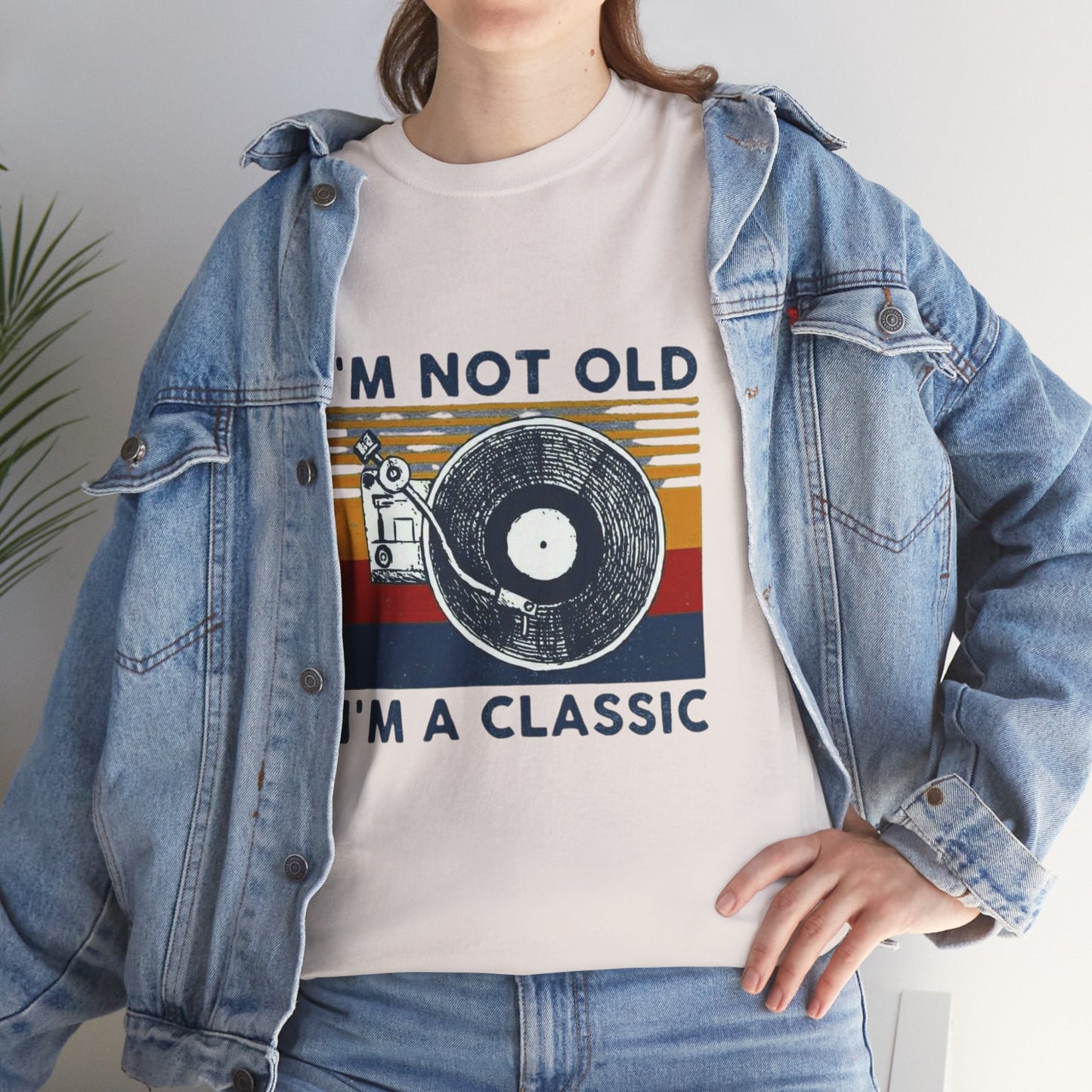 Unisex heavy cotton tee with retro vinyl record graphic and "I'M NOT OLD, I'M A CLASSIC" slogan.