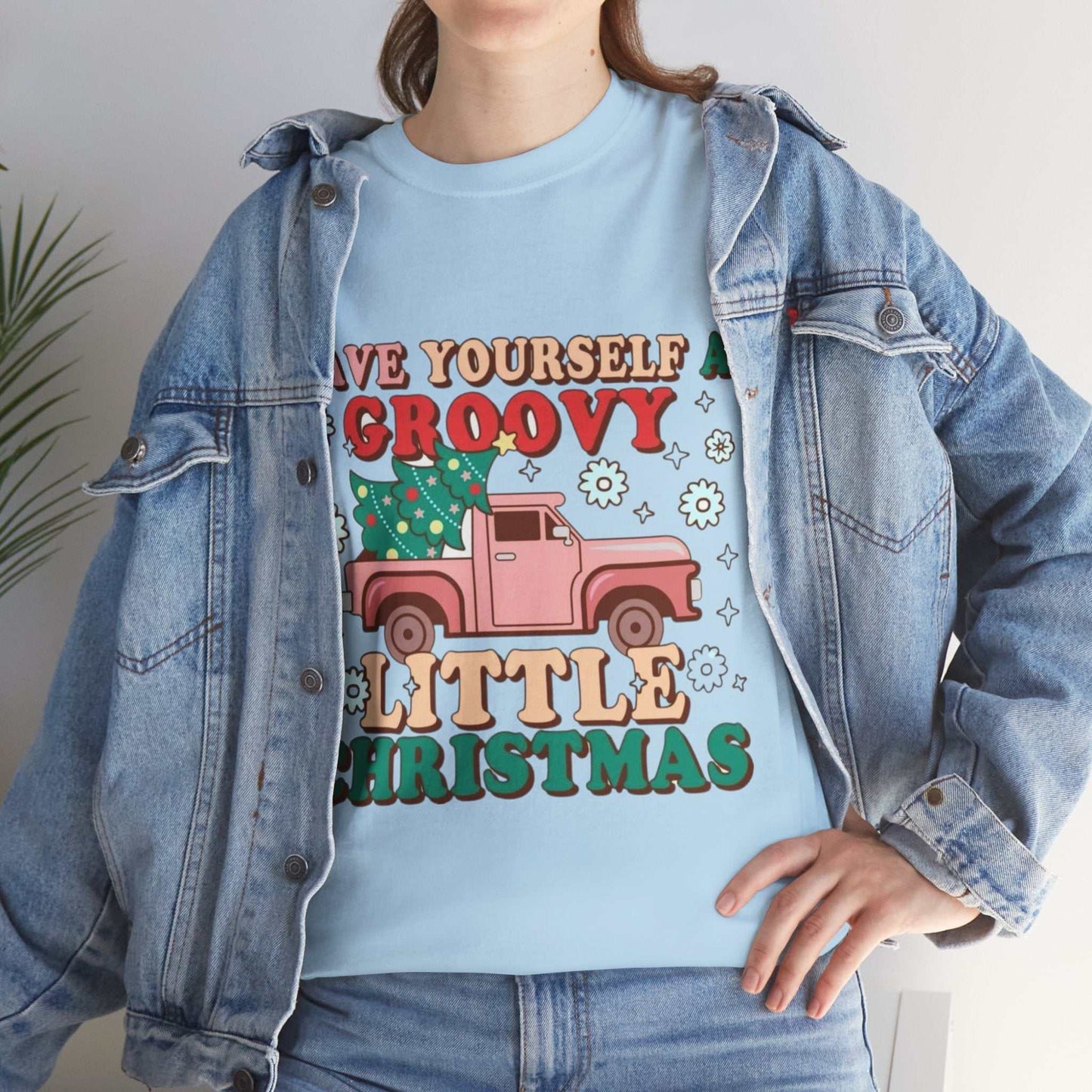 Retro Christmas shirt with festive graphic design and cheerful message, perfect holiday gift.
