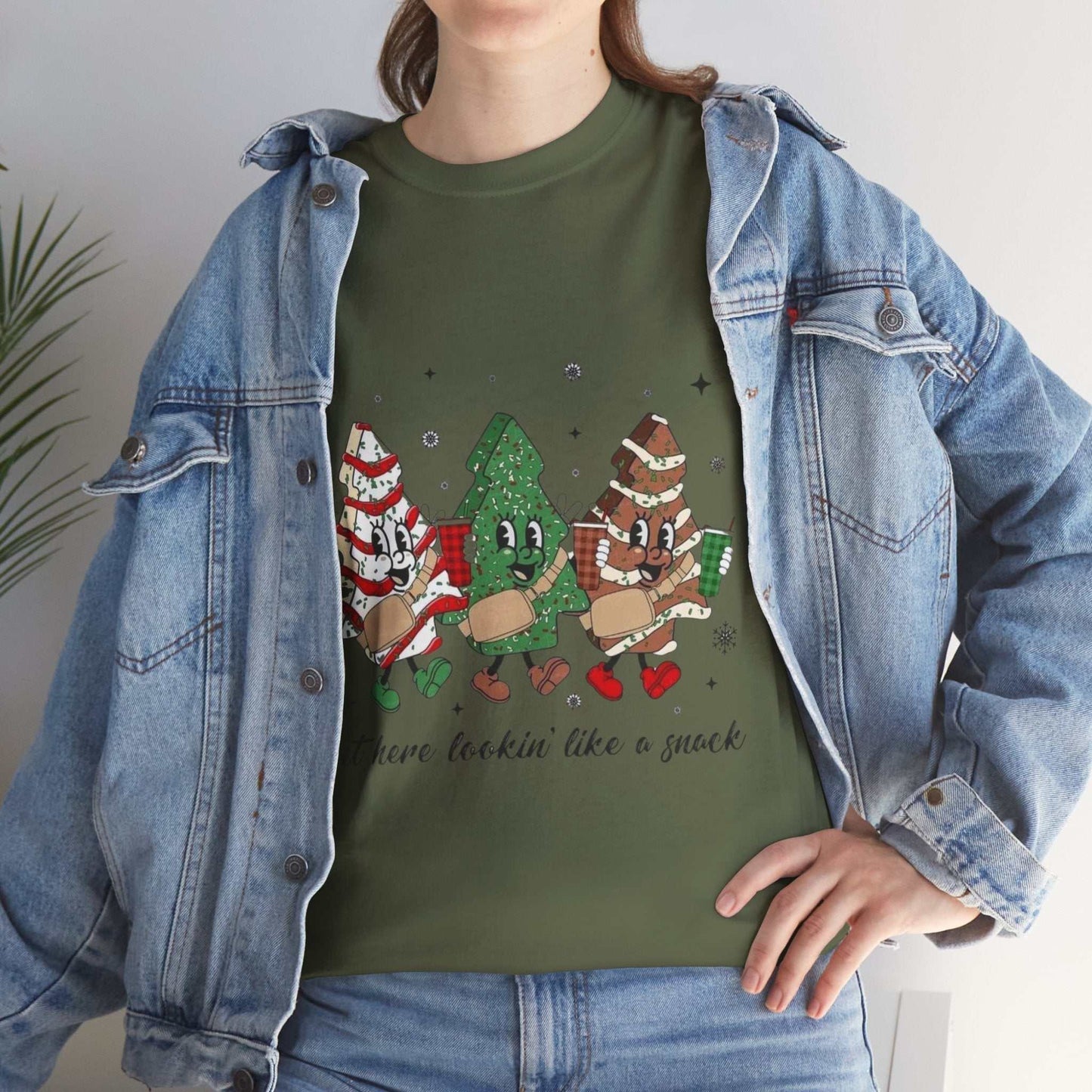Festive "Out Here Looking Like a Snack" Christmas shirt with holiday designs.