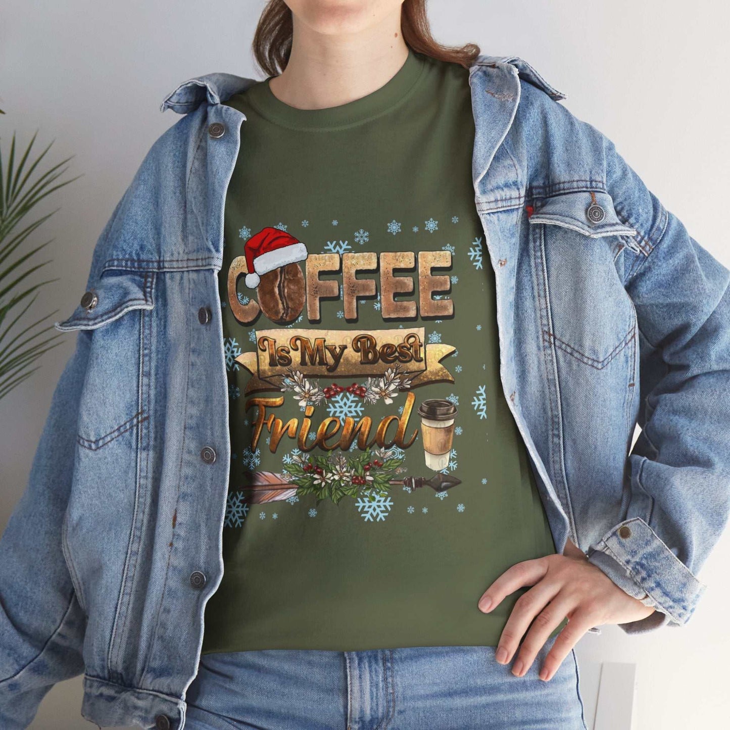 Christmas coffee lover t-shirt with festive design worn under denim jacket.