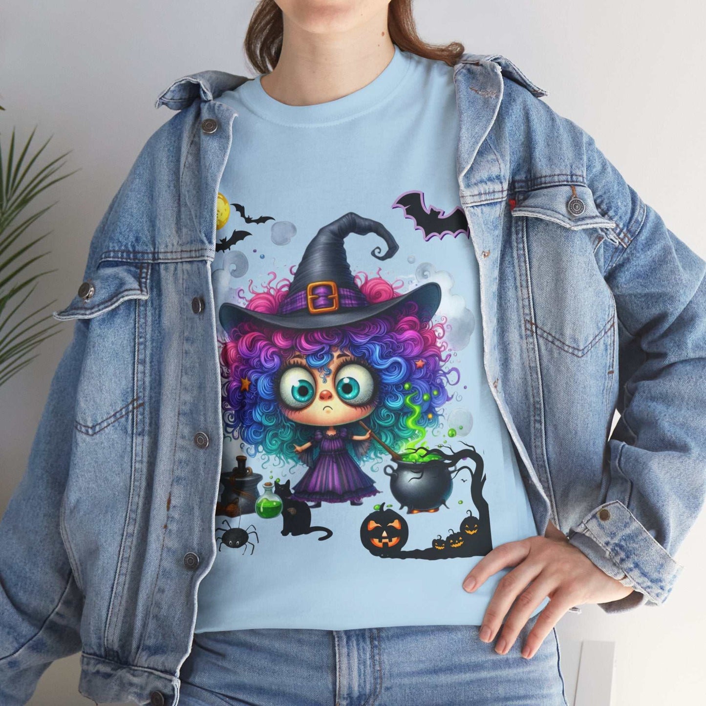 Halloween girl shirt featuring colorful, whimsical ghost design with witch hat, perfect for spooky season.