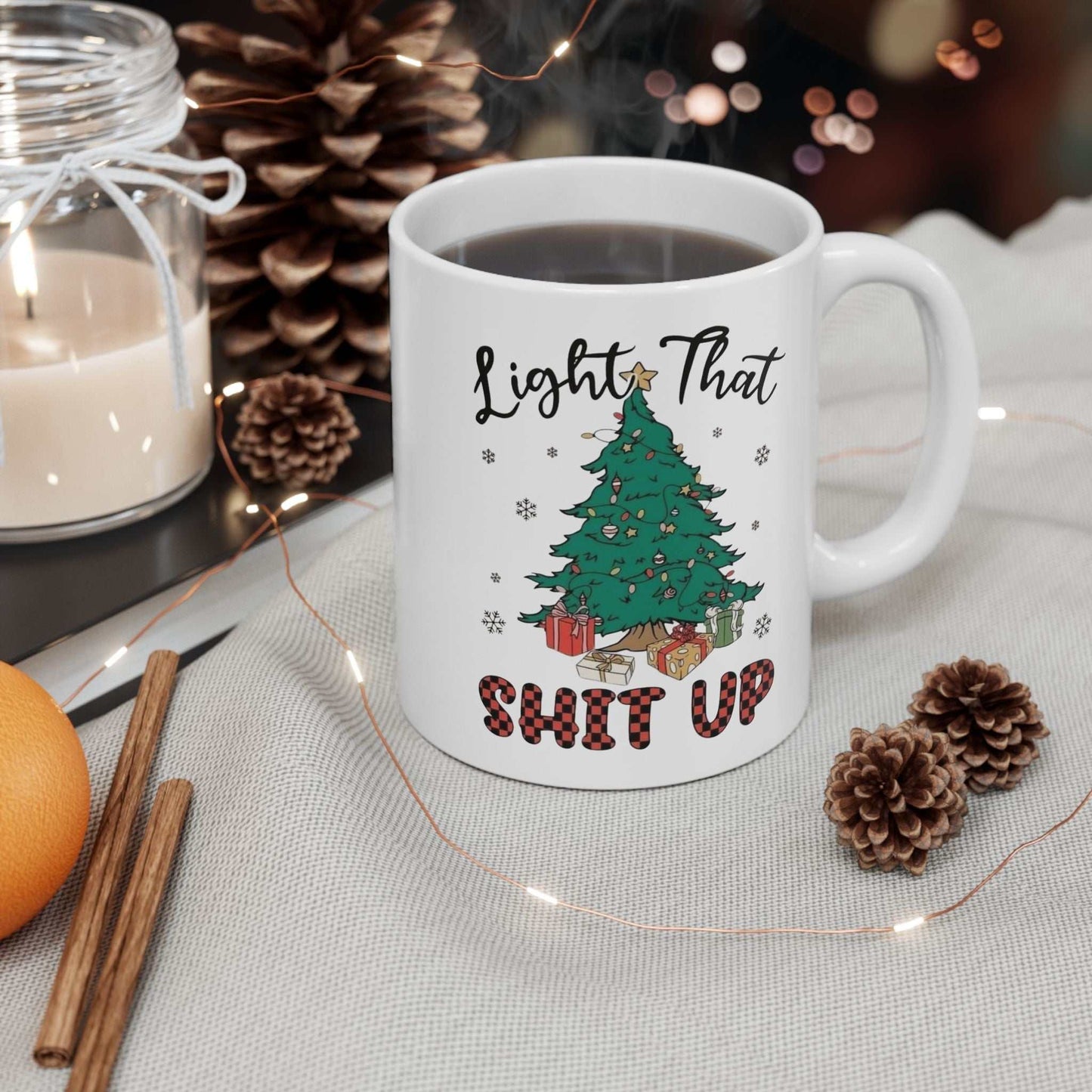 Funny Christmas mug with Light That Shit Up Christmas Mugs" design, featuring a decorated Christmas tree, perfect for holiday celebrations.