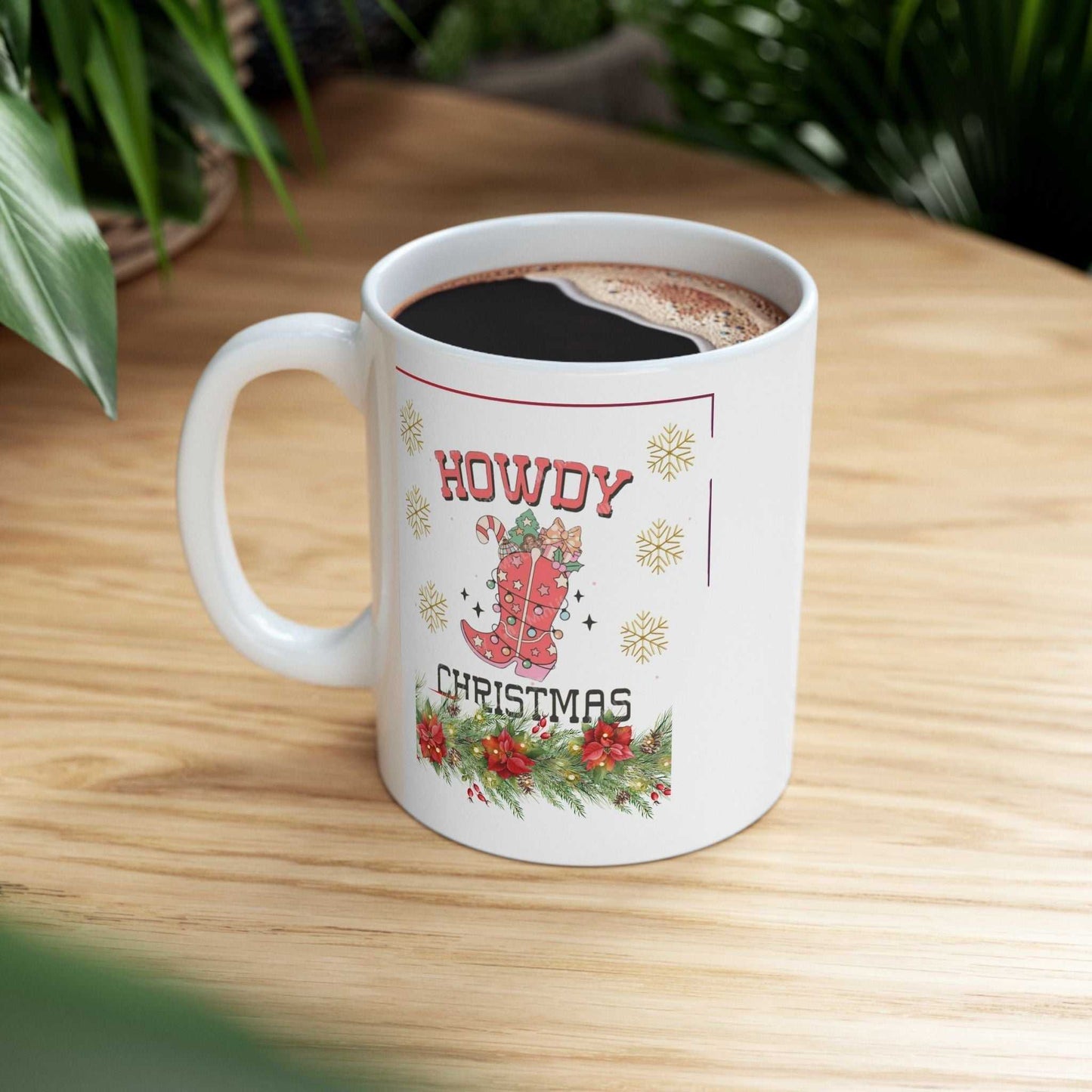 Howdy Christmas Mug Cowboy-themed Christmas mug with festive design on a wooden table.