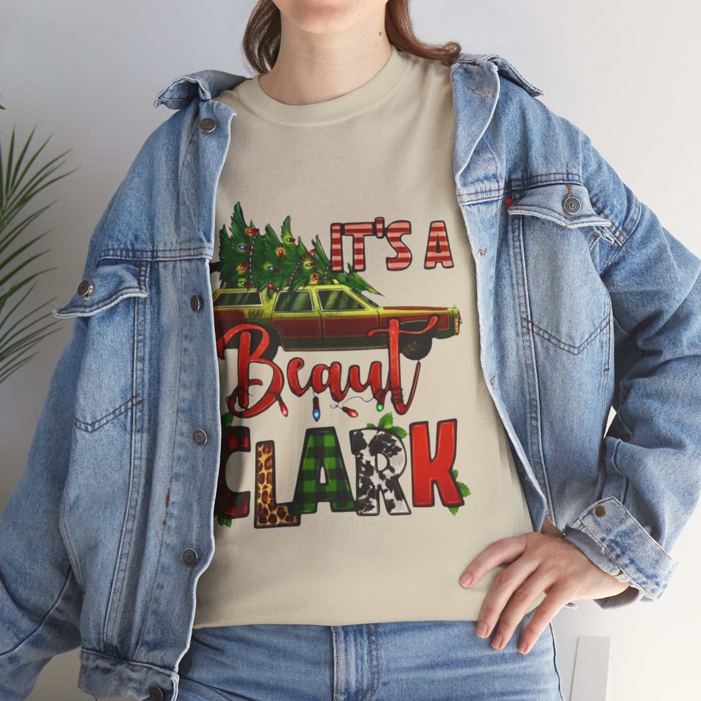 Retro "It's A Beaut Clark" Christmas shirt featuring vintage design and holiday theme.