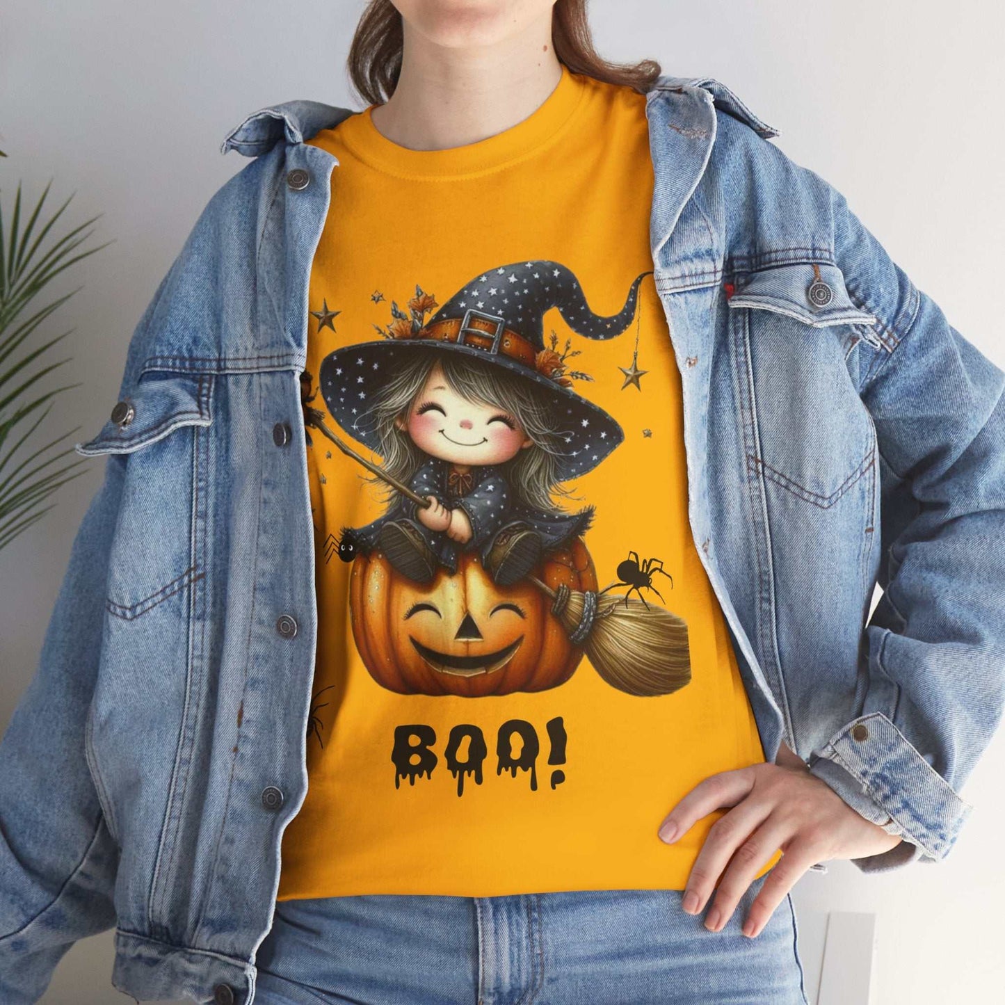 Halloween girl ghost shirt featuring cute witch on pumpkin design.