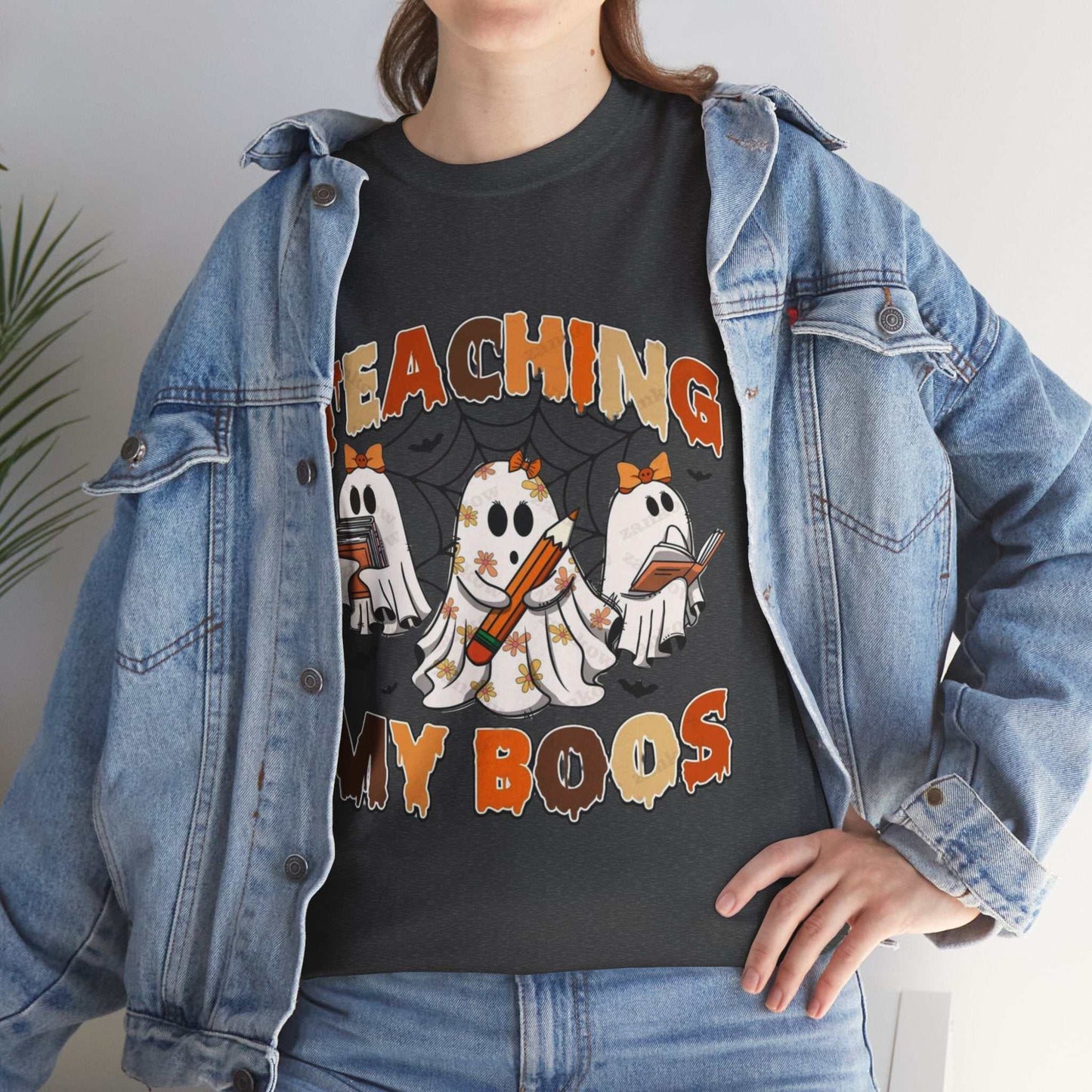 Comfort Colors Teaching My Boos shirt with ghost design, worn under a denim jacket, perfect for Halloween and teachers.