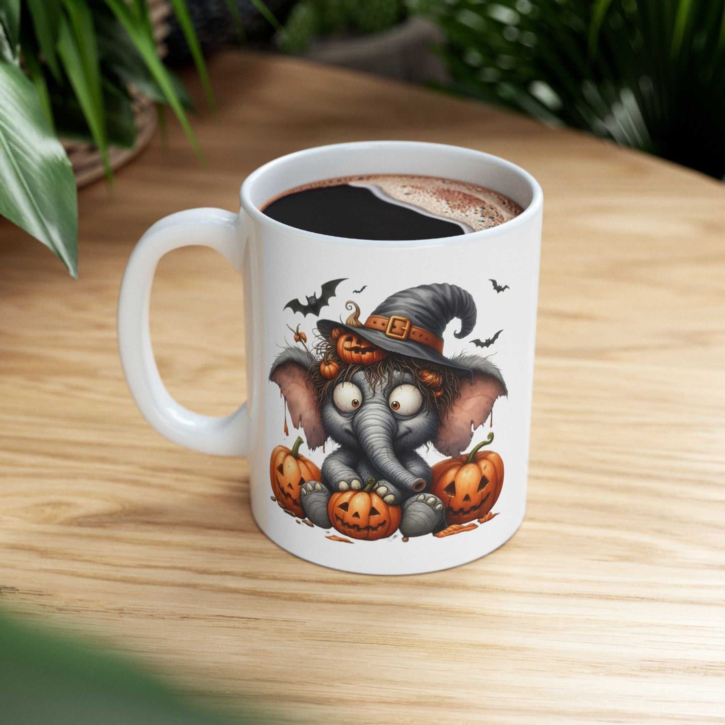 Funny Elephant Halloween Mug with pumpkins, perfect for spooky season gifting.