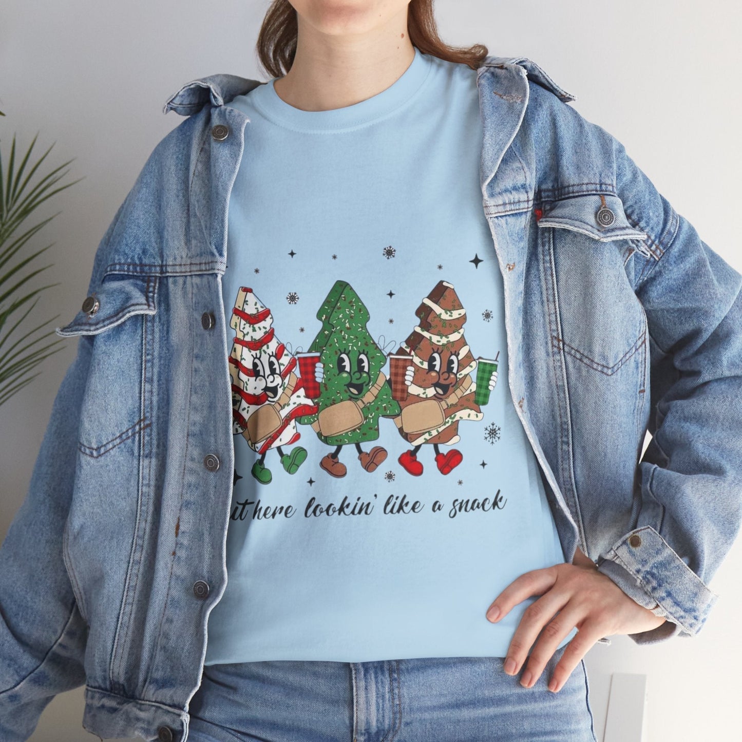 Festive "Out Here Looking Like a Snack" Christmas shirt with holiday-themed cartoon design, perfect Christmas season gift.