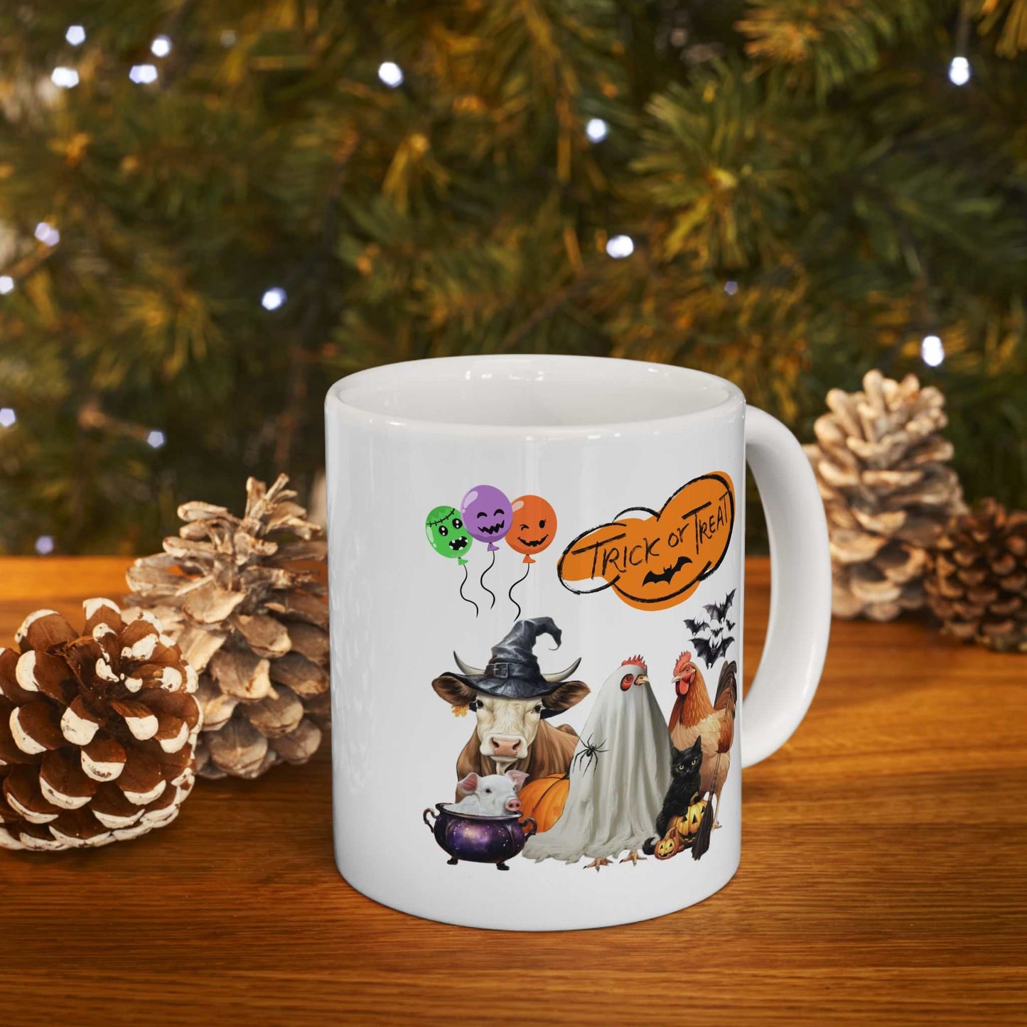 Festive Trick or Treat Halloween Mug with spooky design and animals on a wooden table with pinecones.