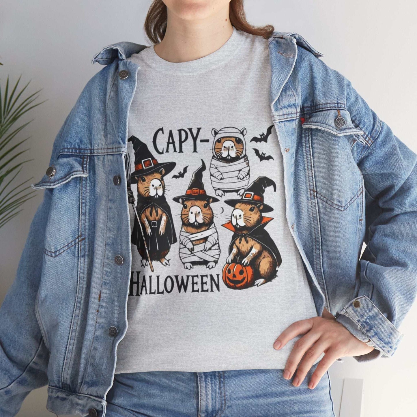 Halloween Capybara Shirt featuring spooky capybaras with pumpkins, perfect for Halloween costumes and gifts.
