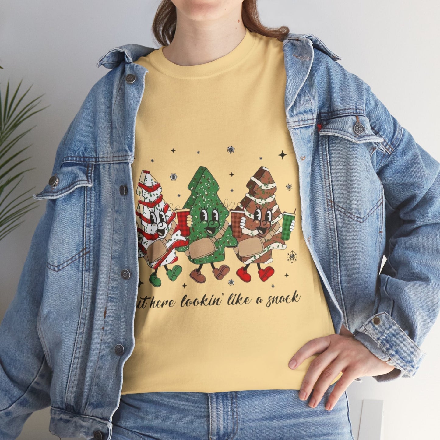 Festive "Out Here Looking Like a Snack" shirt with Christmas-themed design in yellow, perfect for holiday parties.