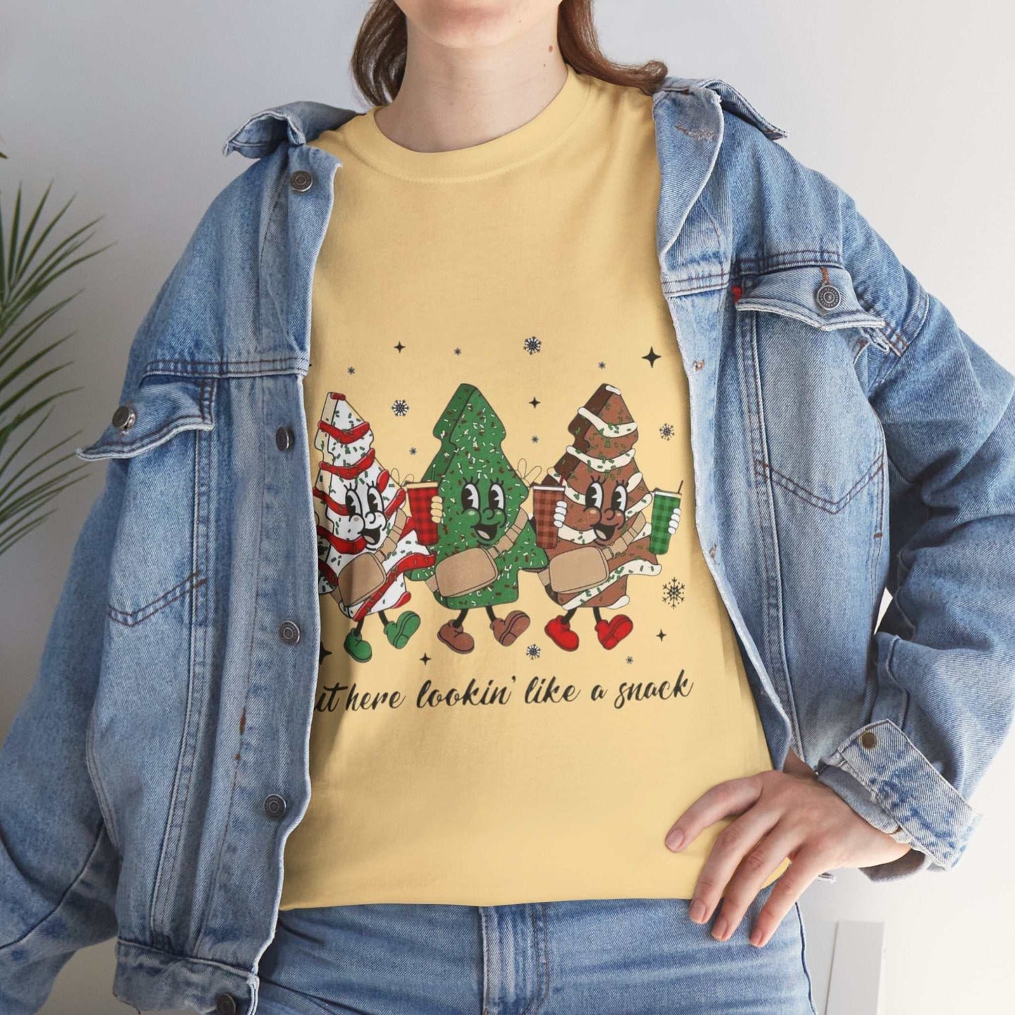 Festive "Out Here Looking Like a Snack" shirt with Christmas-themed design in yellow, perfect for holiday parties.