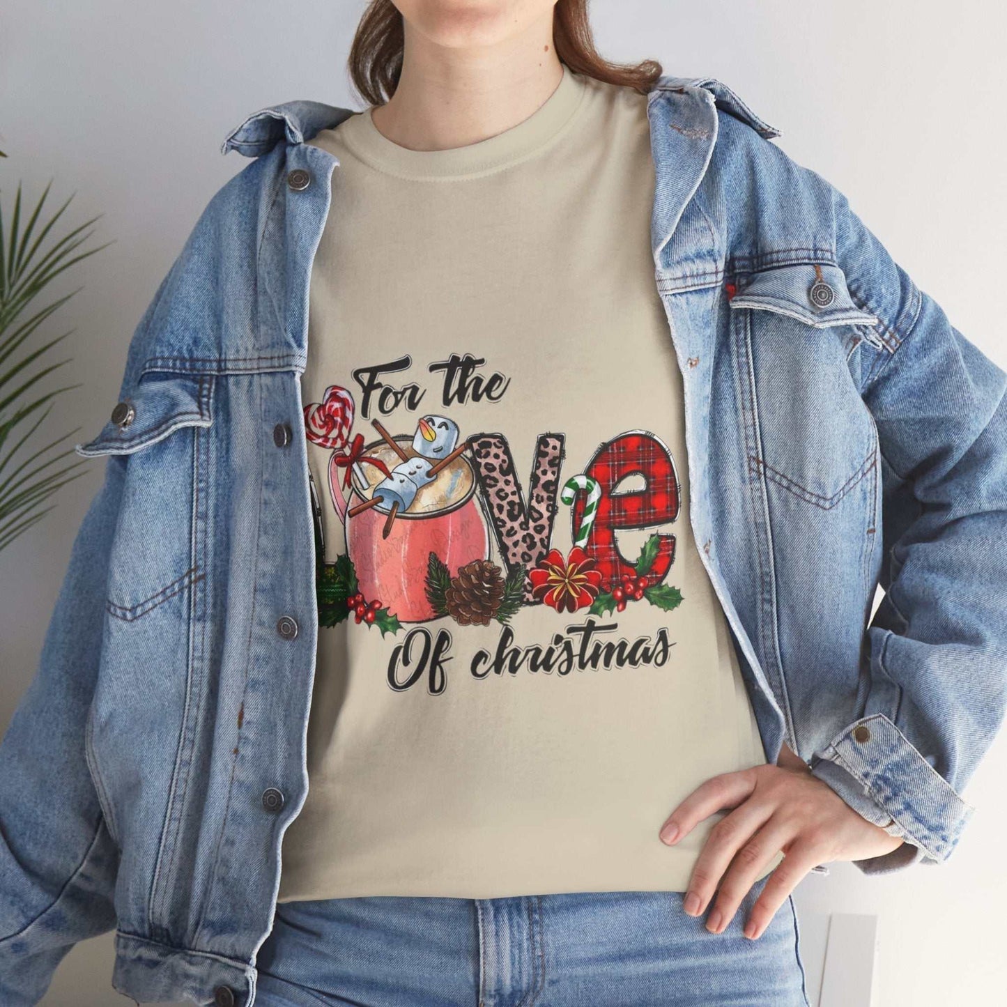 Festive "For The Love Of Christmas Shirt" with holiday design, worn under a denim jacket.