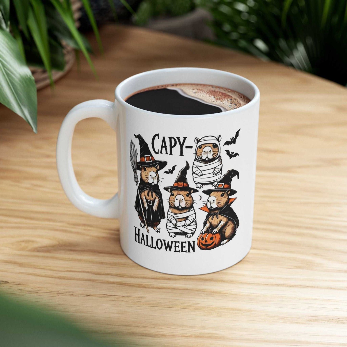 Halloween Capybara Mug with spooky capybara designs, 11oz ceramic, on wooden table.