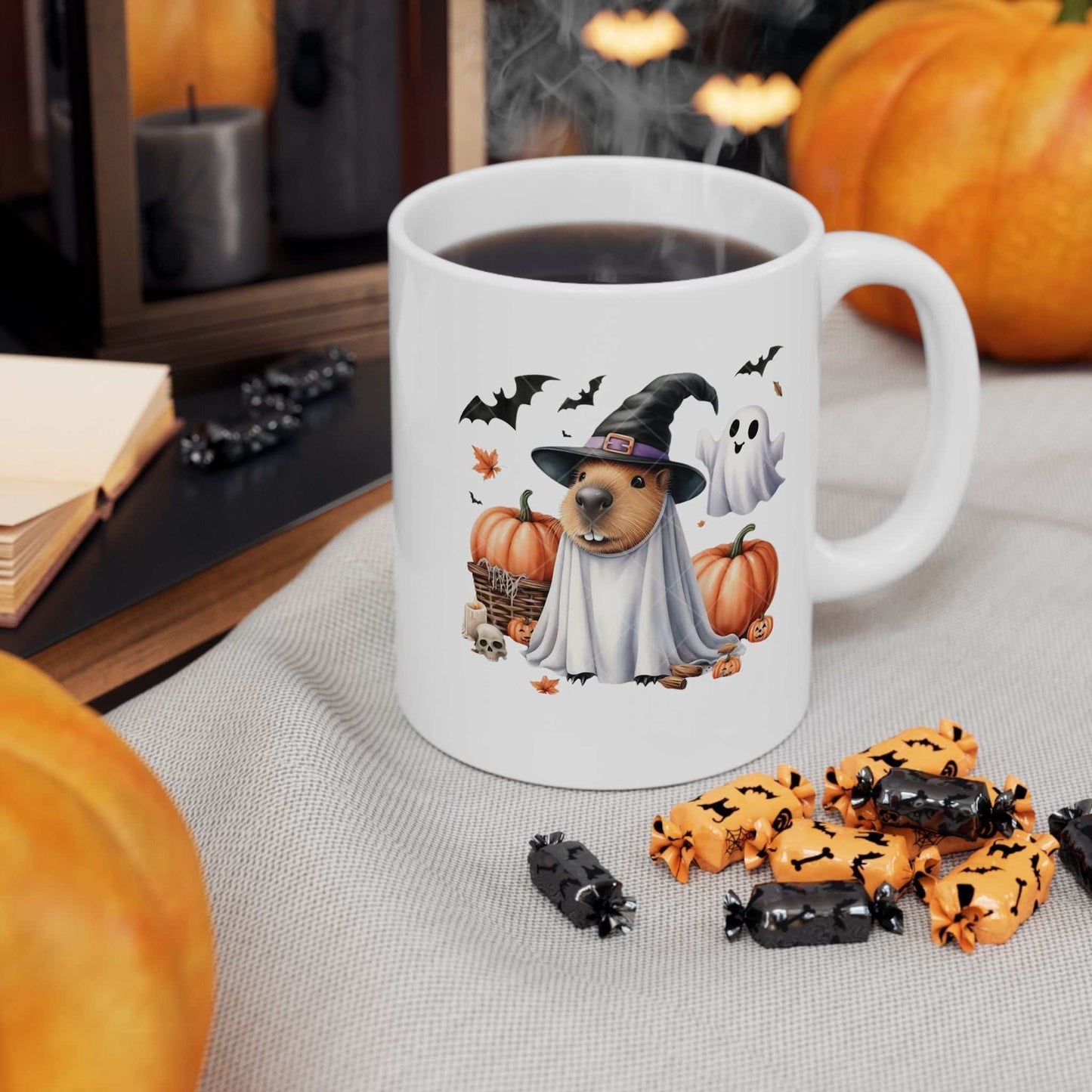 Halloween capybara mug with witch hat and pumpkins, perfect for spooky season.