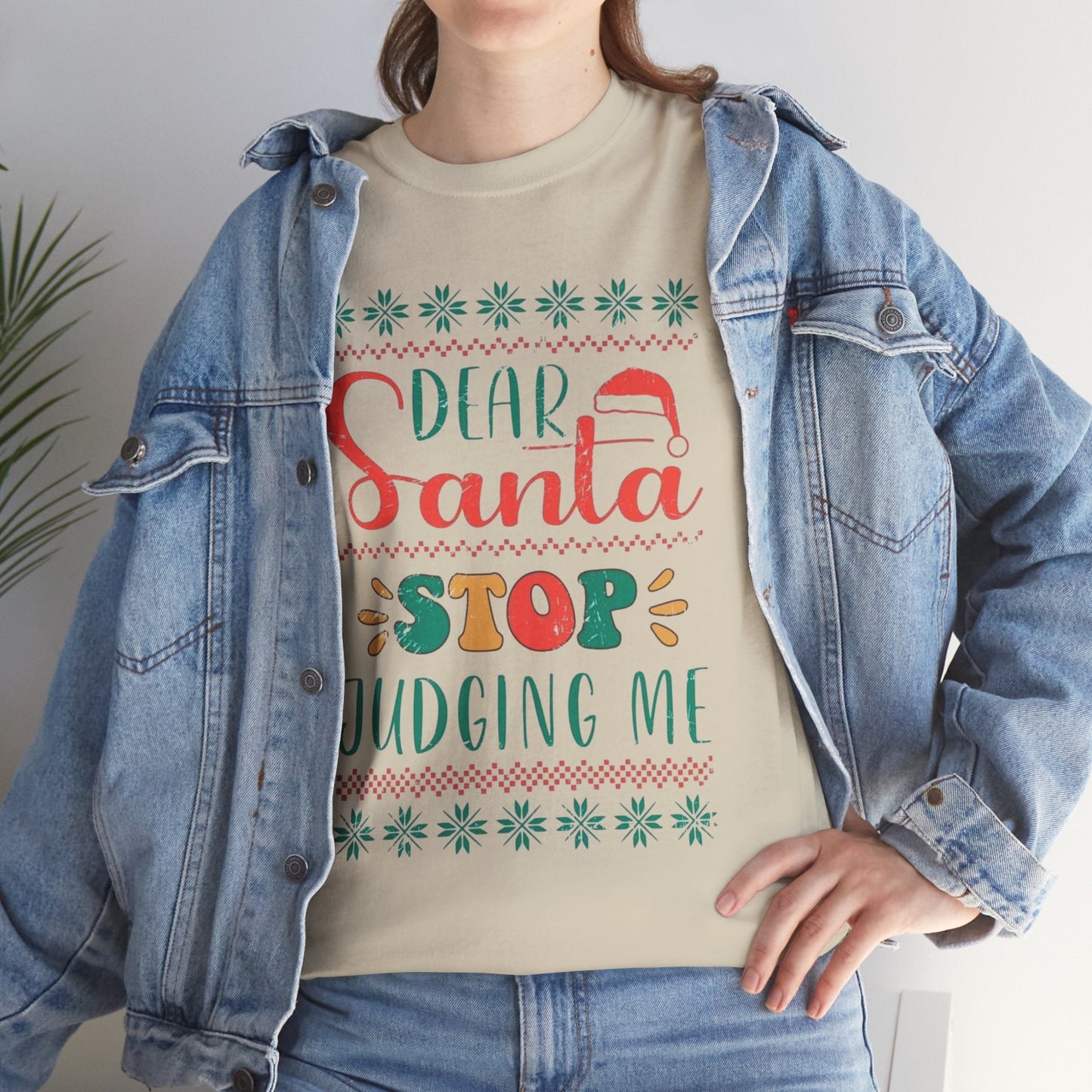 Funny Christmas shirt with "Dear Santa, Stop Judging Me" message in festive colors, ideal for holiday gatherings.