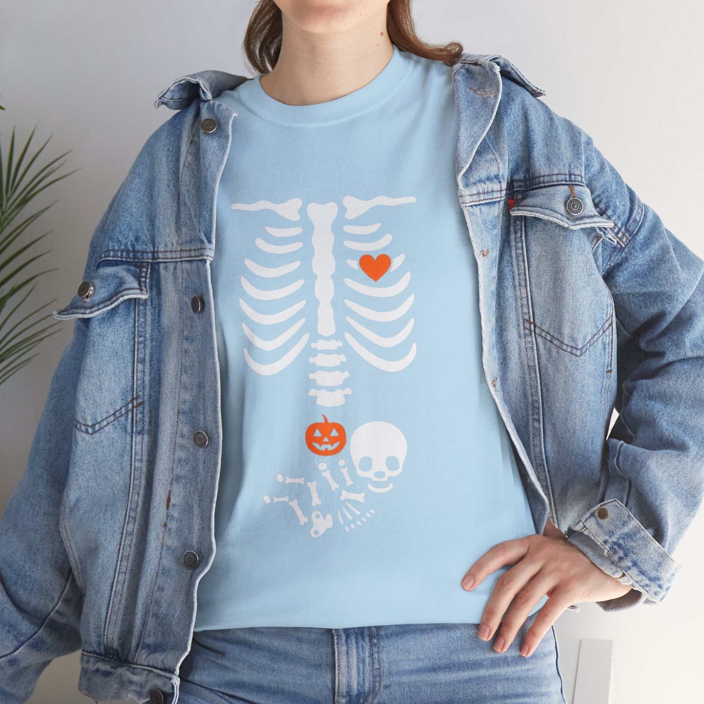 Halloween maternity shirt with skeleton design, perfect for pregnancy announcements and gifts.