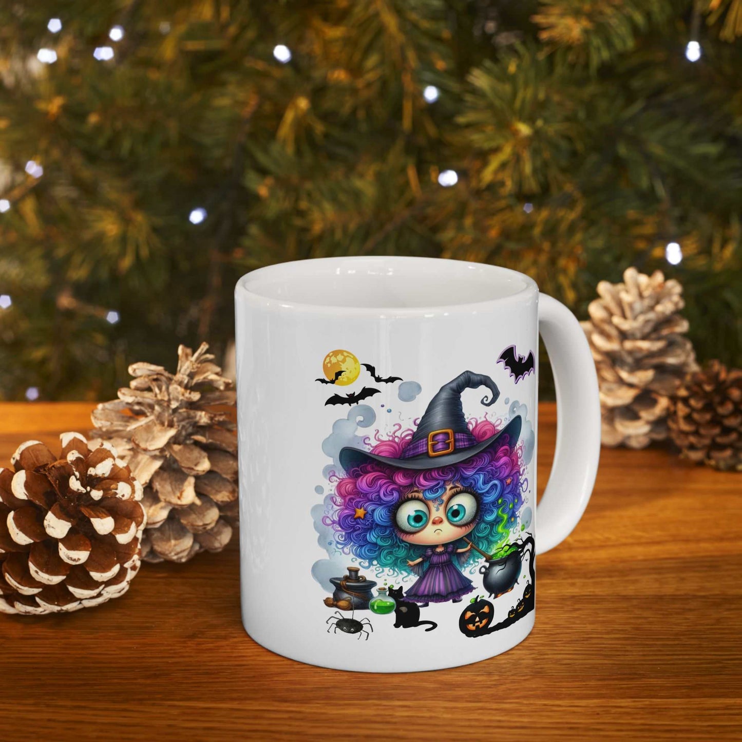 Halloween mug with colorful girl witch design, surrounded by pinecones and lights.