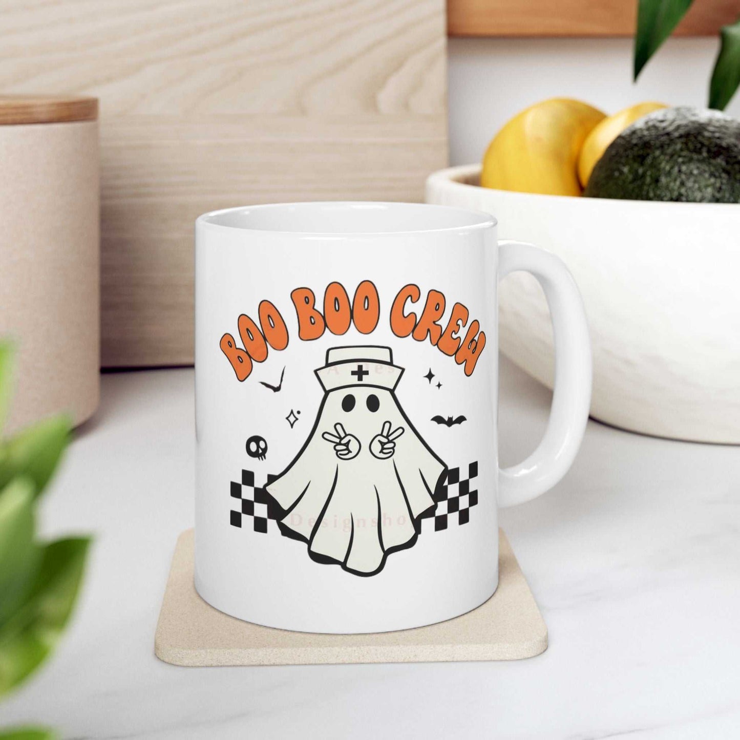Ceramic coffee mug with "Boo Nurse Crew Halloween" design featuring a cute ghost nurse graphic, perfect for Halloween and healthcare professionals.