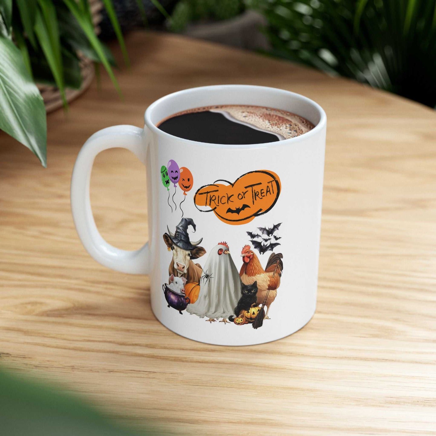Trick or Treat Halloween Mug featuring spooky festive design with animals.