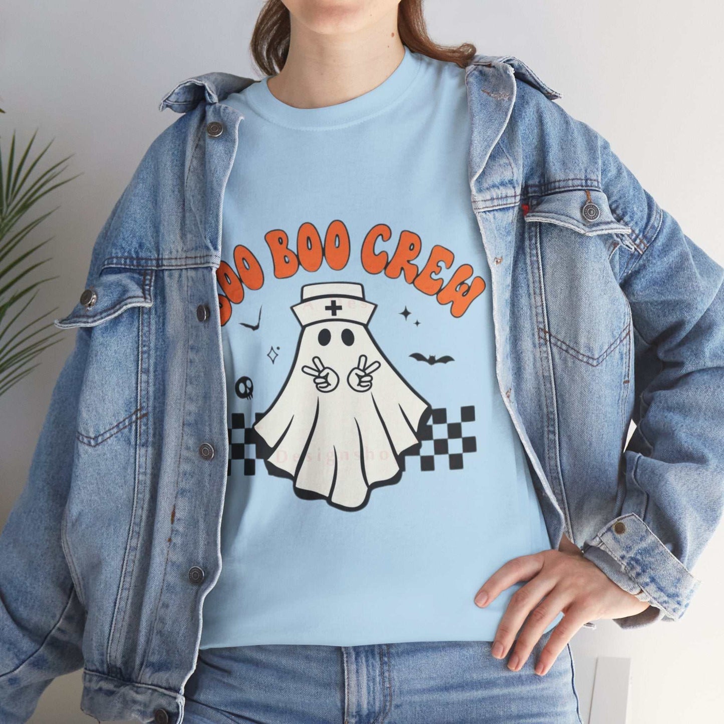Unisex Halloween tee with "Boo Nurse Crew" ghost graphic, perfect for spooky nurse outfits.