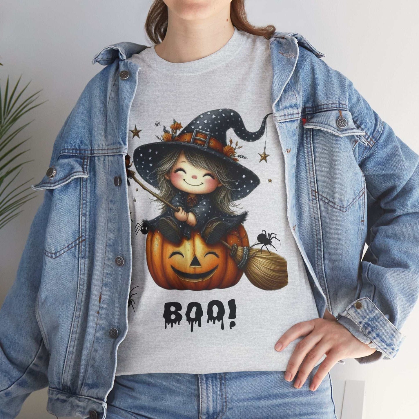 Cute ghost-themed Halloween girl shirt with witch and pumpkin graphic, perfect for festive kids' fashion.