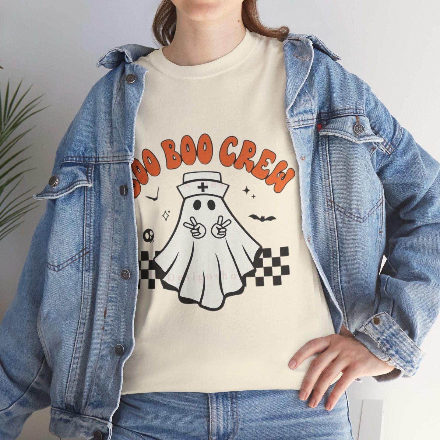 Boo Nurse Crew Halloween unisex tee with ghost design, cute and spooky nurse shirt.