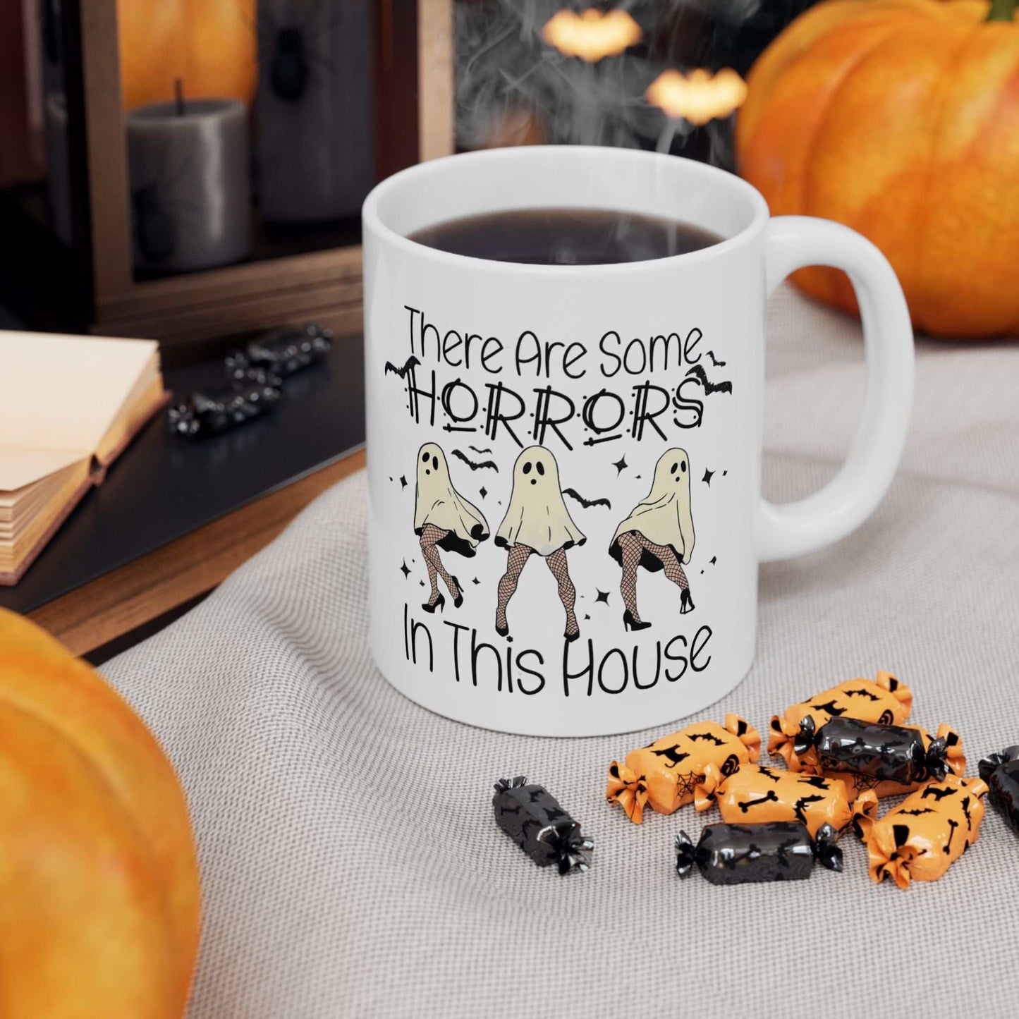 Funny Halloween mug with ghost design and text, perfect for festive coffee moments.