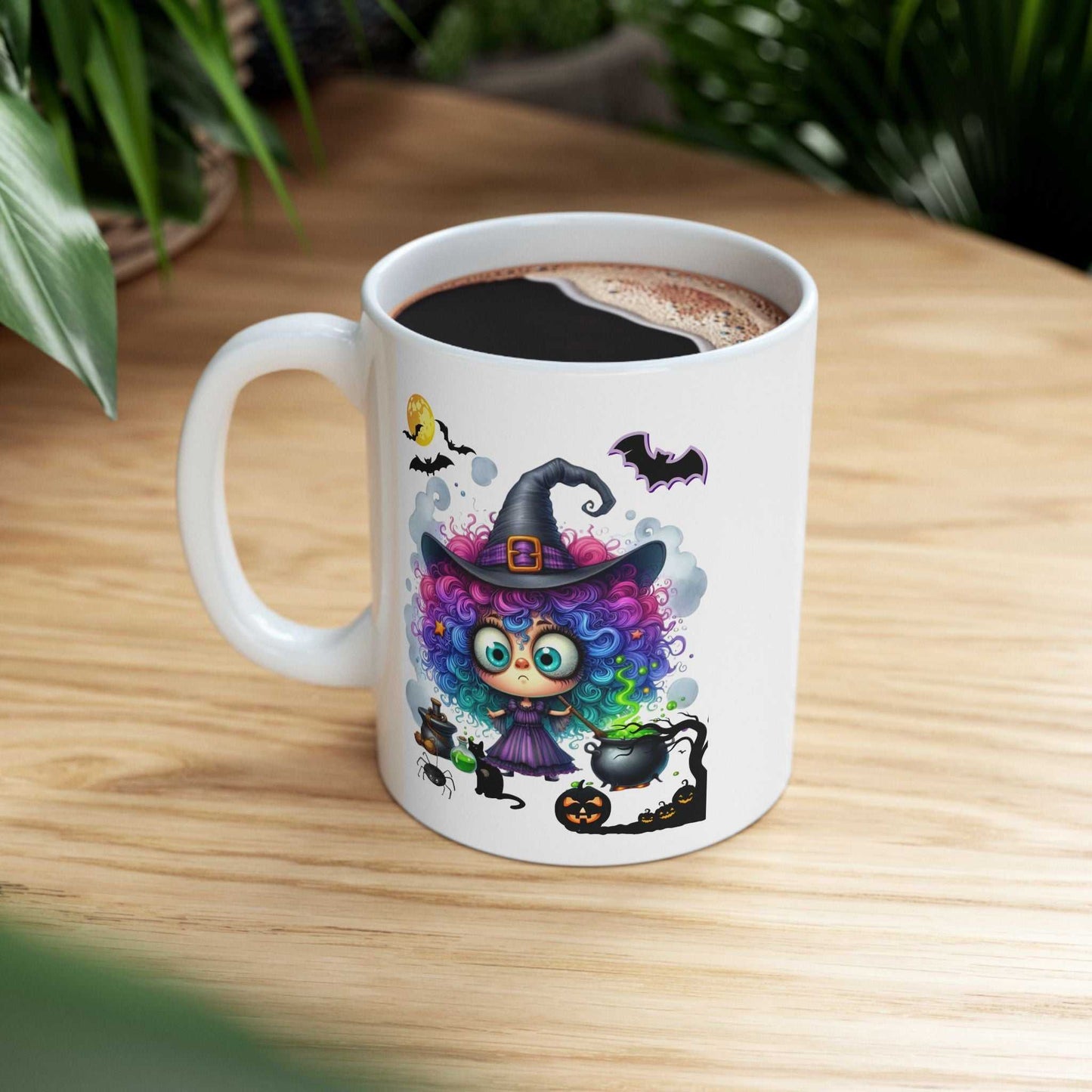 Halloween girl ghost mug with colorful witch design on a wooden table.