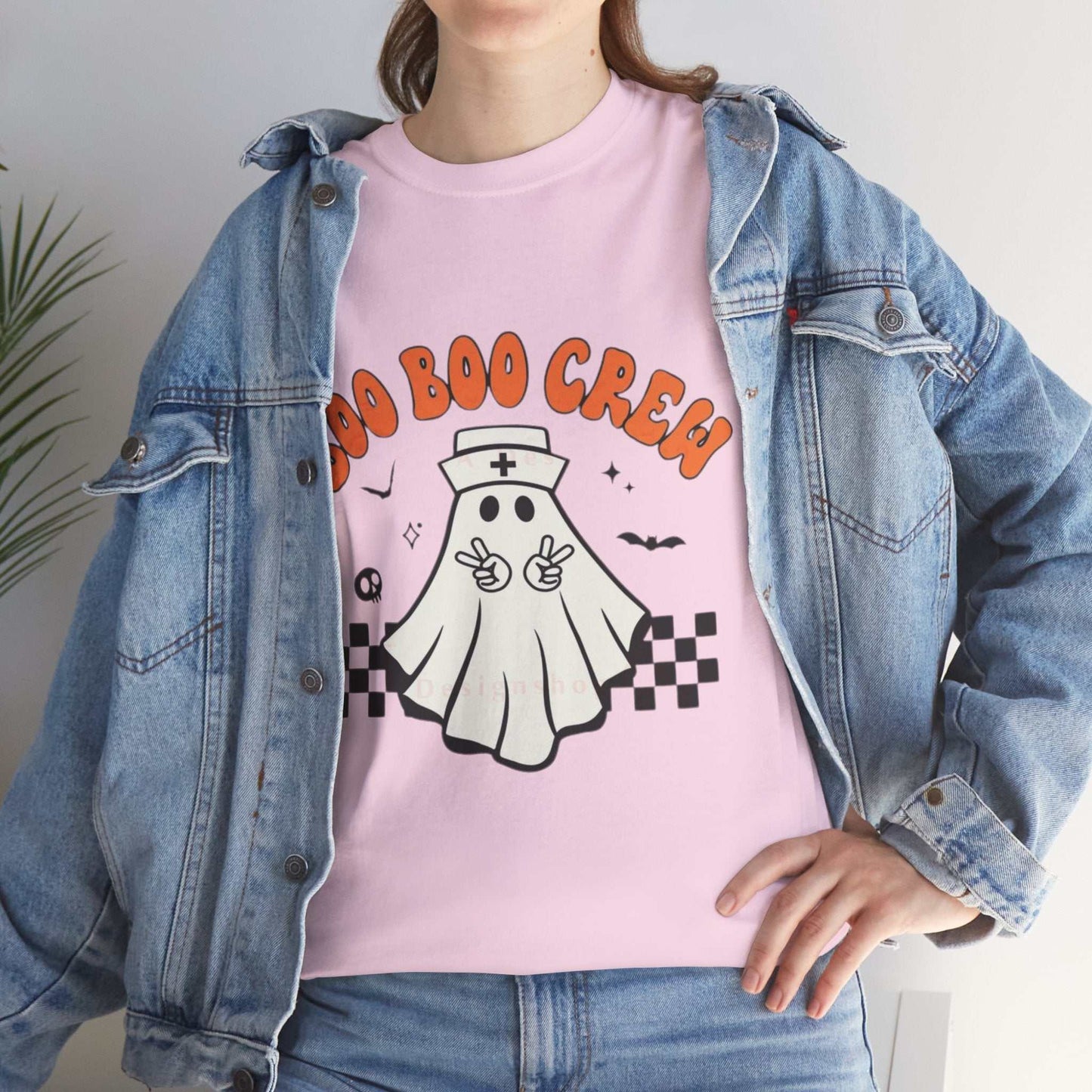 Unisex heavy cotton tee with "Boo Nurse Crew" Halloween ghost design, perfect for casual fashion and durability.