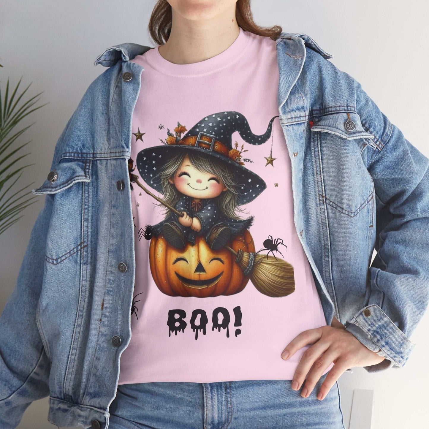 Halloween girl ghost shirt featuring cute witch design on pink cotton tee, perfect for spooky season.