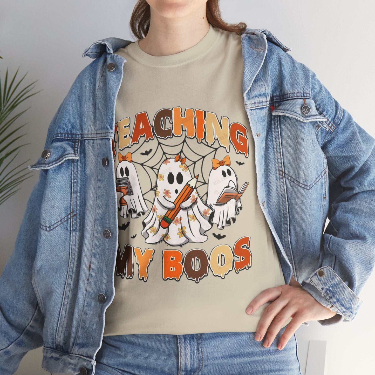Unisex heavy cotton tee with ghost and Halloween-themed "Teaching My Boos" design, ideal for teachers.