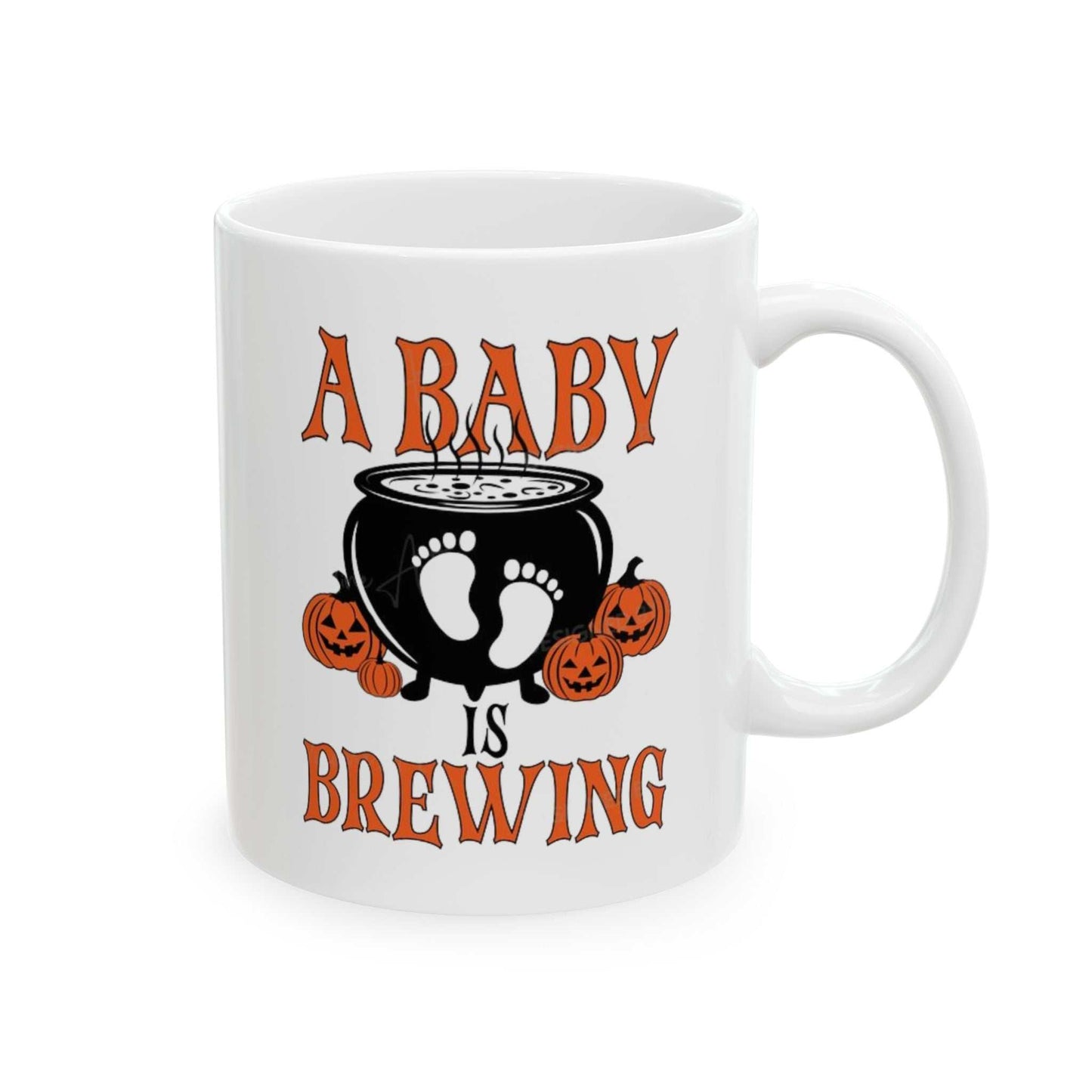 Ceramic mug with "A Baby is Brewing" design, featuring cauldron and pumpkins, perfect for Halloween pregnancy announcements.