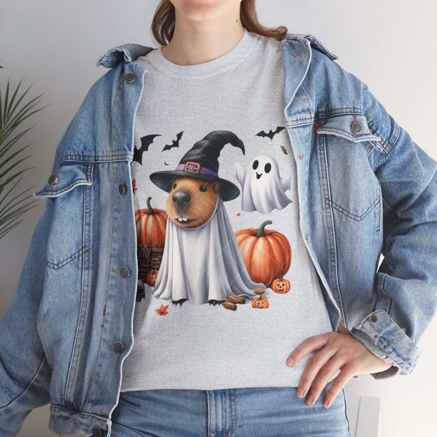 Unisex Halloween capybara shirt with spooky costume design featuring pumpkins and bats.