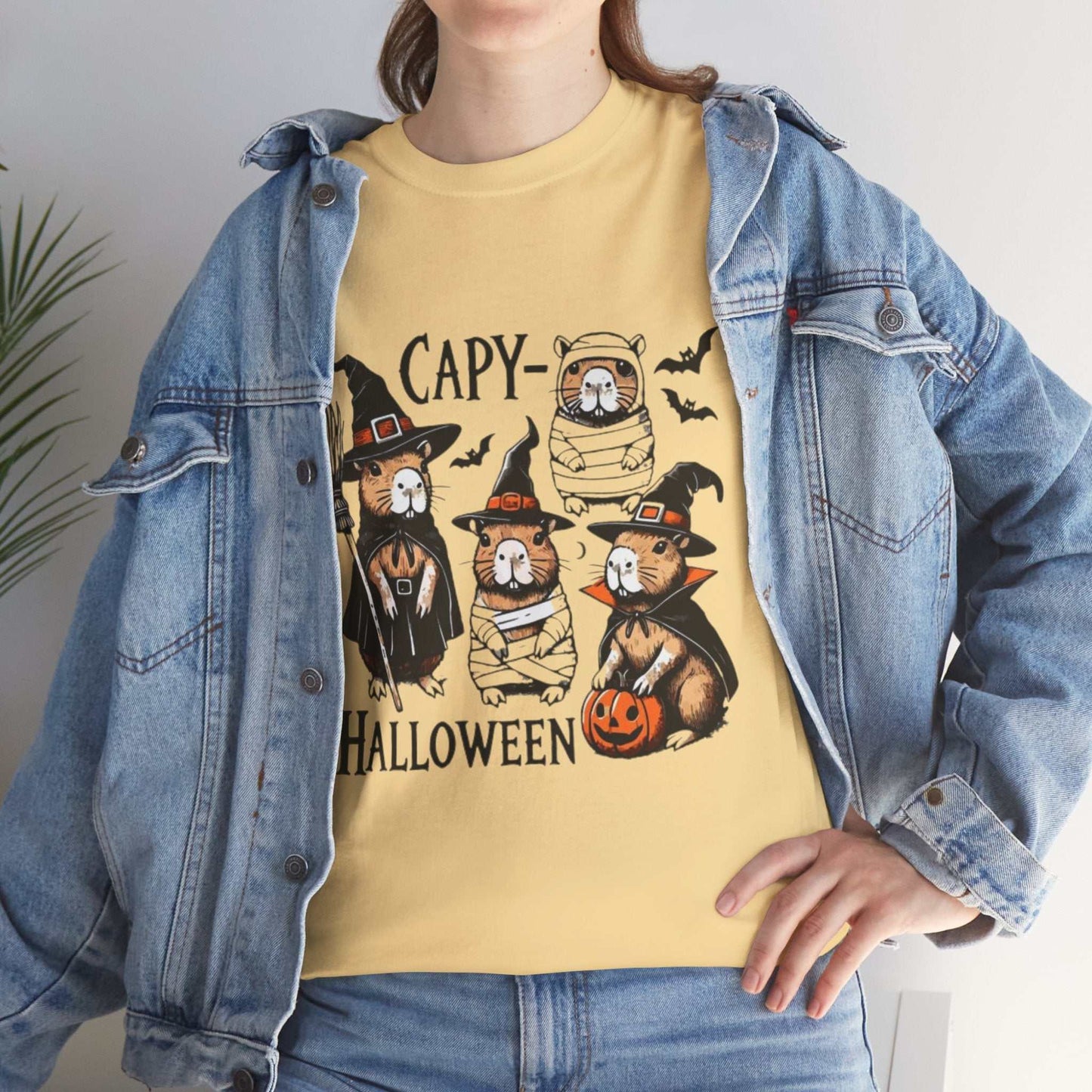 Halloween Capybara Shirt with spooky capybara design, pumpkins, and bats.
