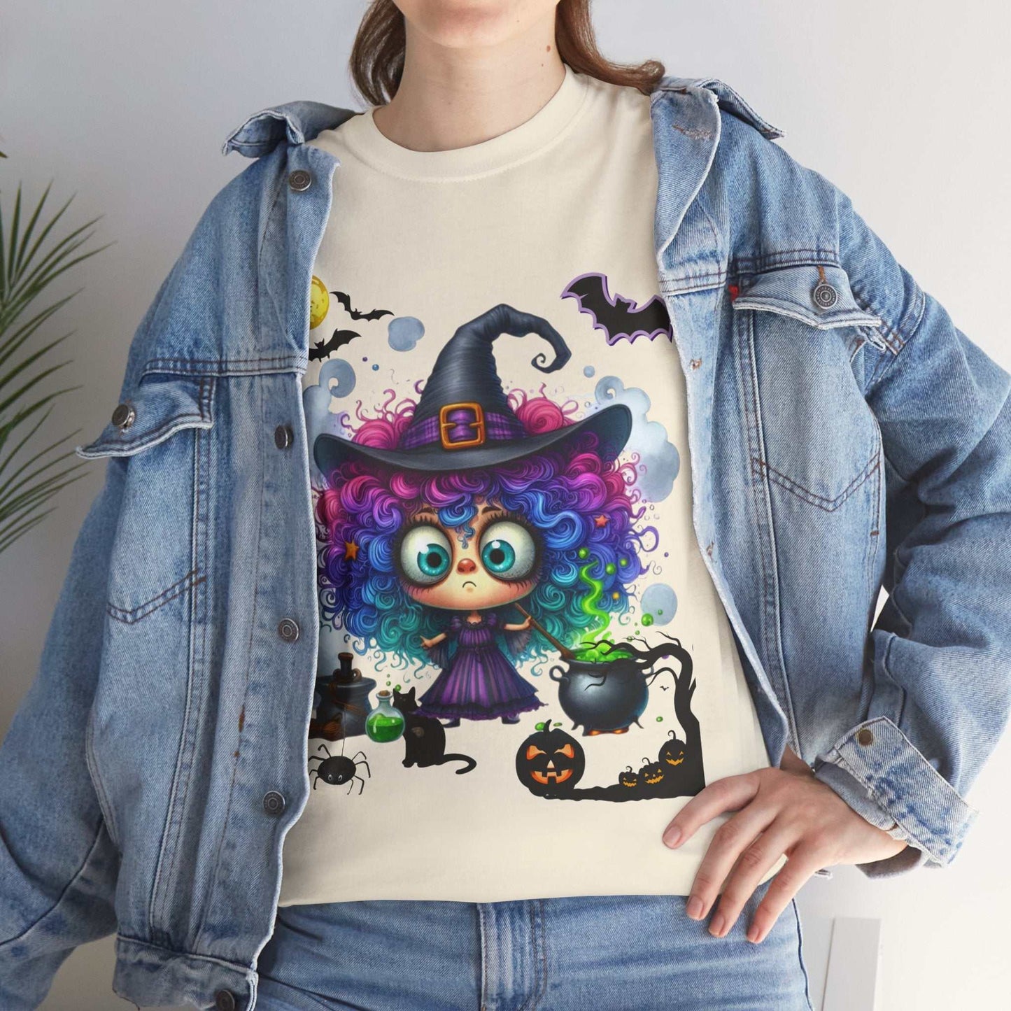 Halloween girl shirt featuring a colorful witch design worn under a denim jacket.